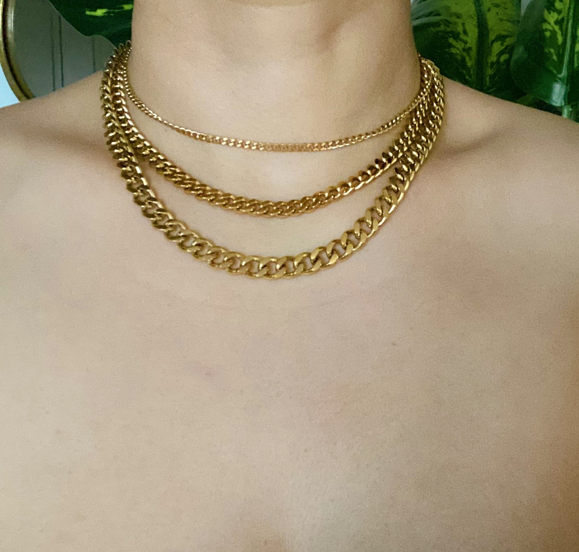 Stylish Cuban Chain Necklace in gold with varying widths, showcasing its elegant design and quality craftsmanship.