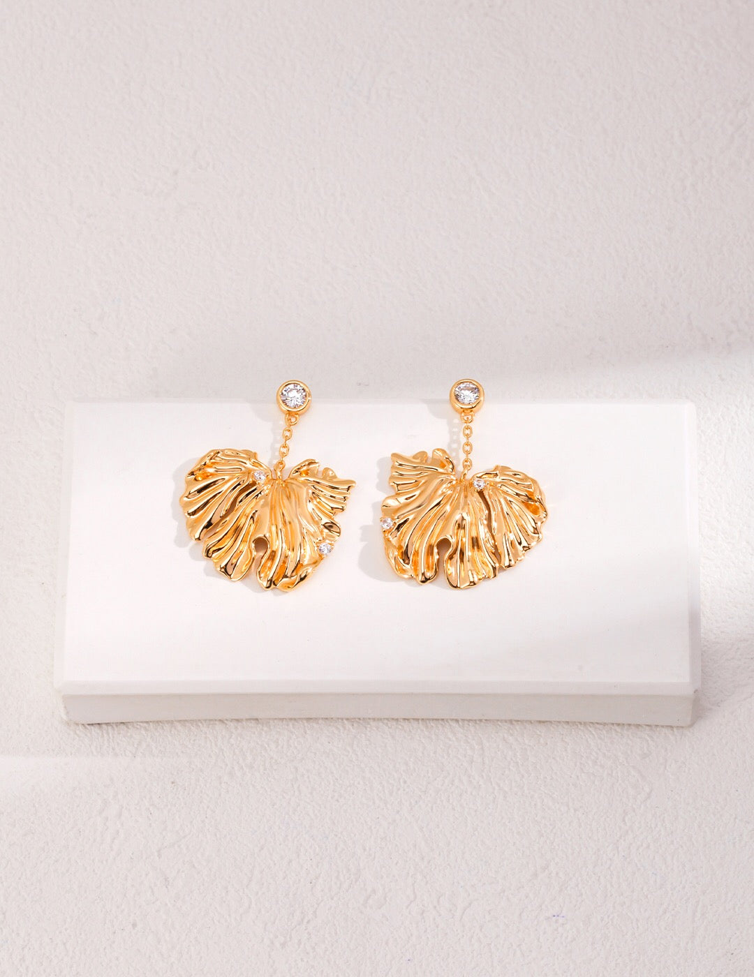 Stylish Leave Style Zircon Earrings featuring zircon stones set in sterling silver with gold vermeil plating, elegantly designed in a leaf shape.