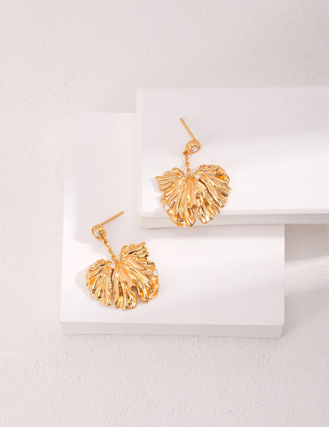 Stylish Leave Style Zircon Earrings featuring zircon stones set in sterling silver with gold vermeil plating, elegantly designed in a leaf shape.