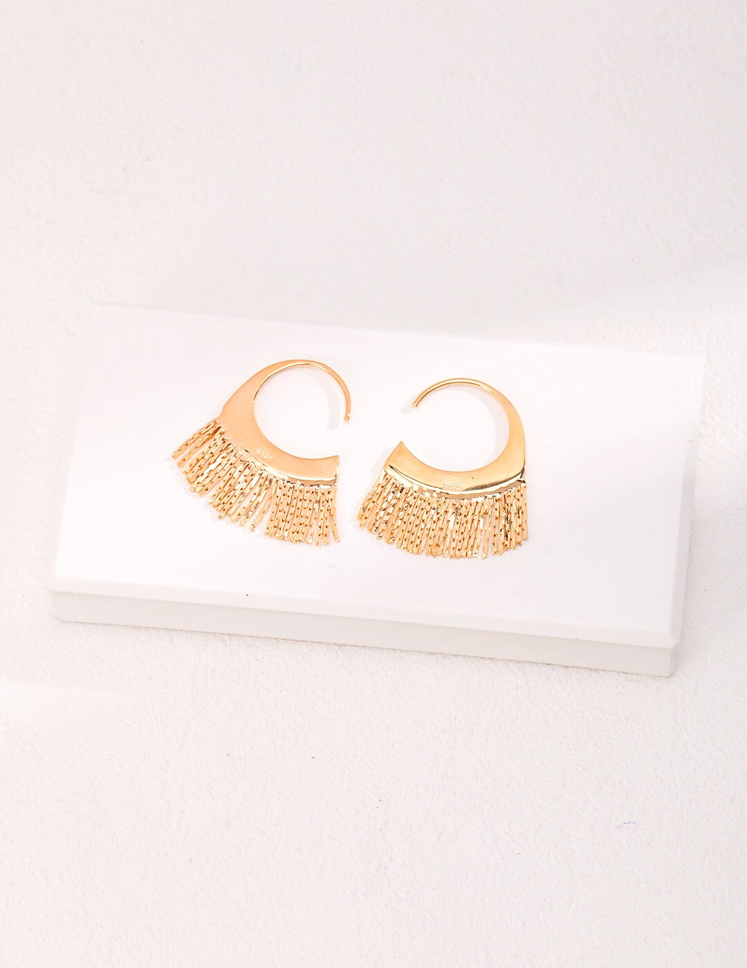 Stylish Scalloped Tassel Earrings in gold vermeil, showcasing a chic design with a scalloped edge and tassel detail.