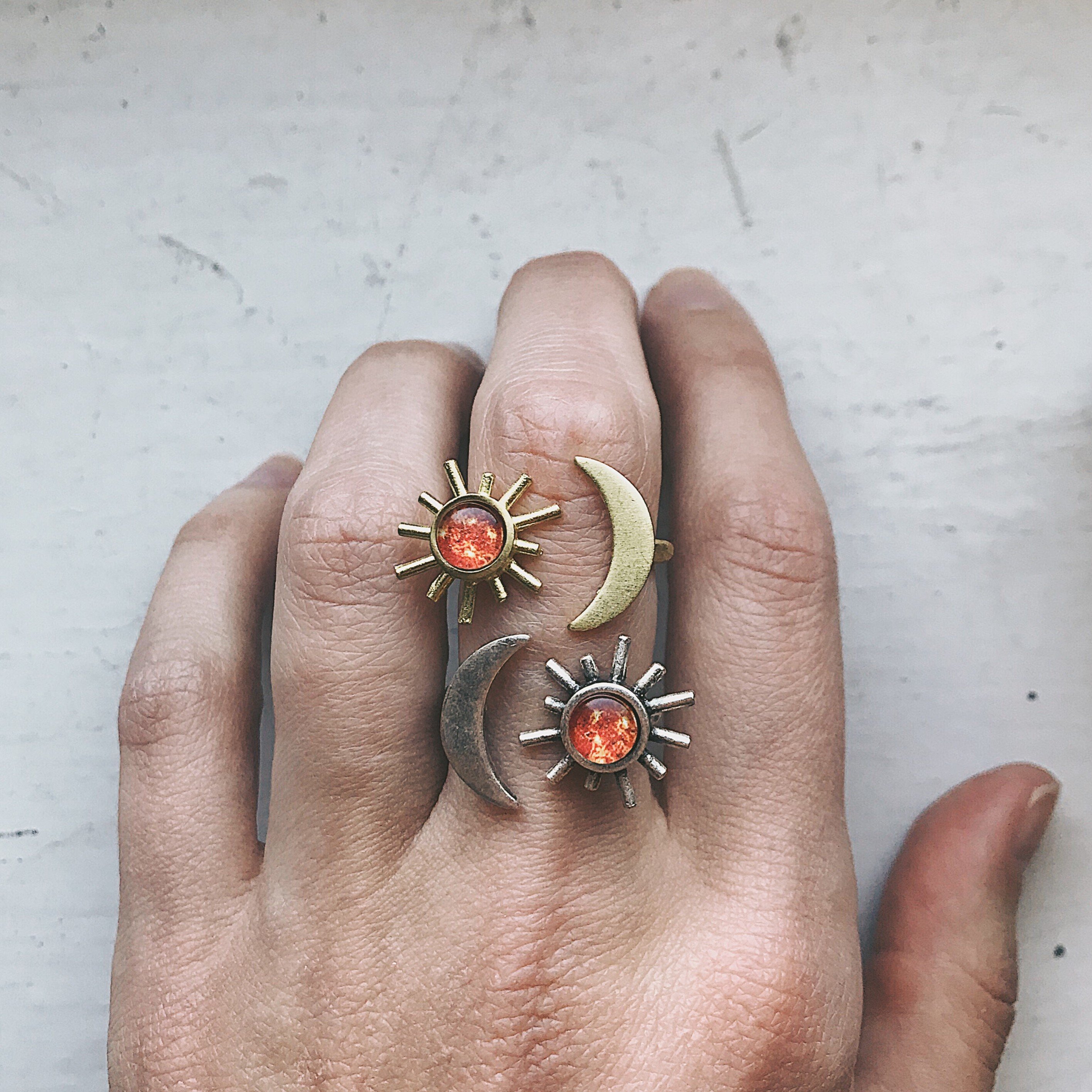 A beautifully handcrafted Sun and Moon Sculptural Statement Ring featuring a vibrant sun and serene moon design, available in silver or gold tone.