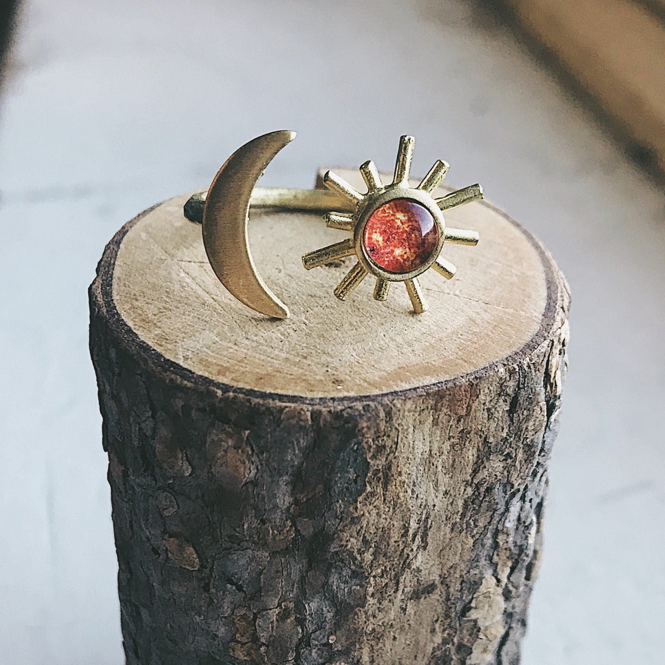 A beautifully handcrafted Sun and Moon Sculptural Statement Ring featuring a vibrant sun and serene moon design, available in silver or gold tone.