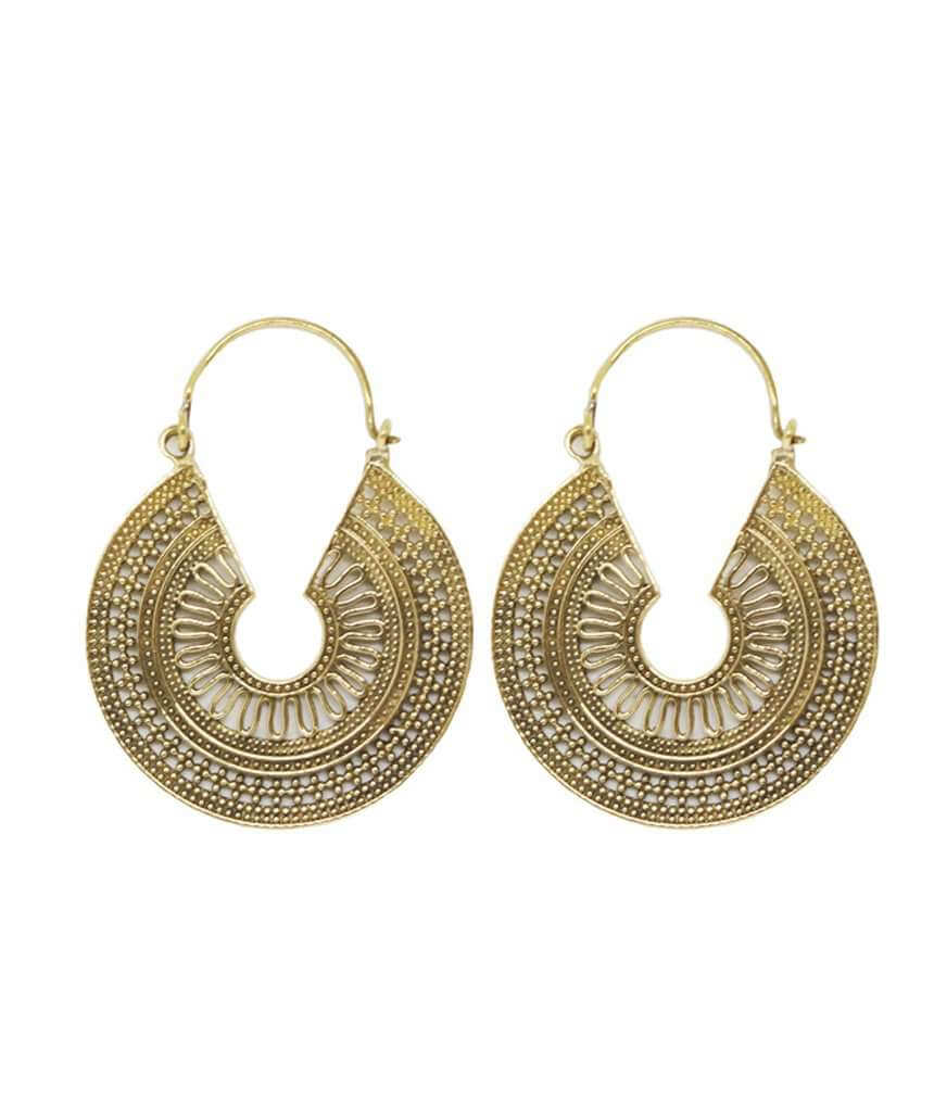 A pair of ornate brass hoop earrings with intricate etched designs, showcasing their unique craftsmanship and elegant finish.