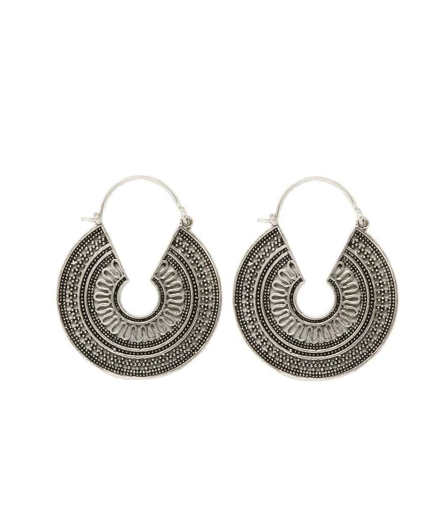 A pair of ornate brass hoop earrings with intricate etched designs, showcasing their unique craftsmanship and elegant finish.