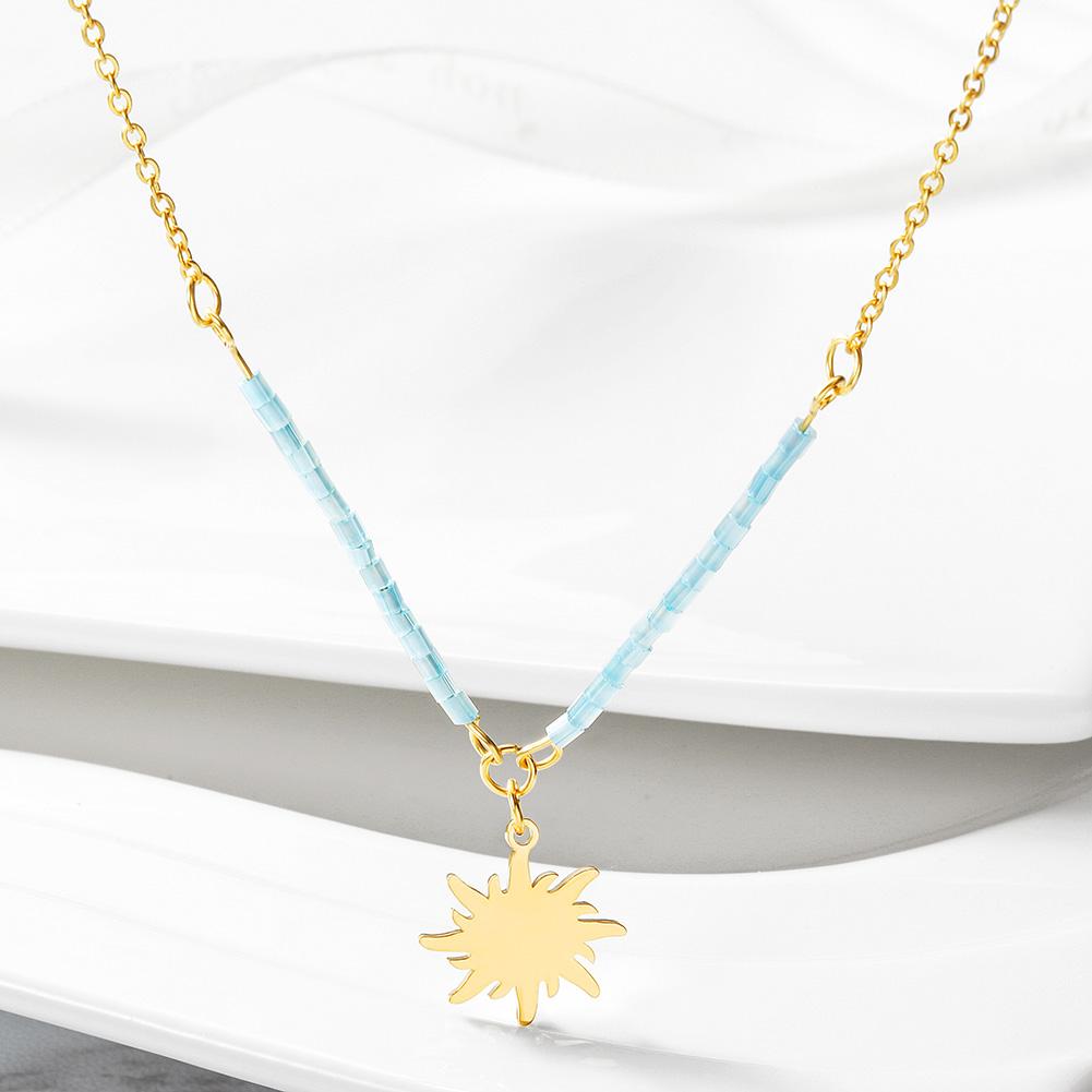 Elegant Sun Pendant Necklace made of stainless steel with gold plating, showcasing a radiant sun design.