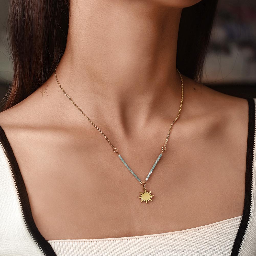 Elegant Sun Pendant Necklace made of stainless steel with gold plating, showcasing a radiant sun design.