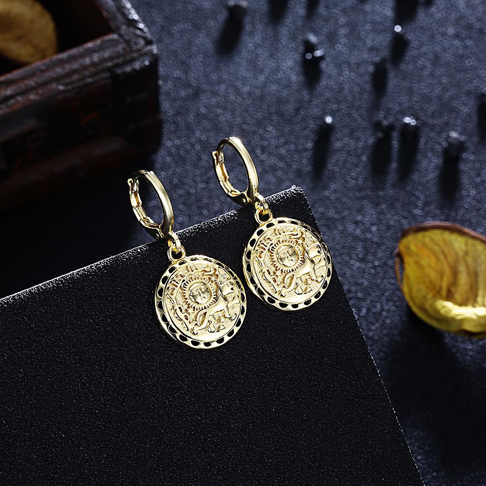 Elegant Sun Scribed Medallion Drop Earrings in 14K Gold, showcasing intricate design and luxurious finish.