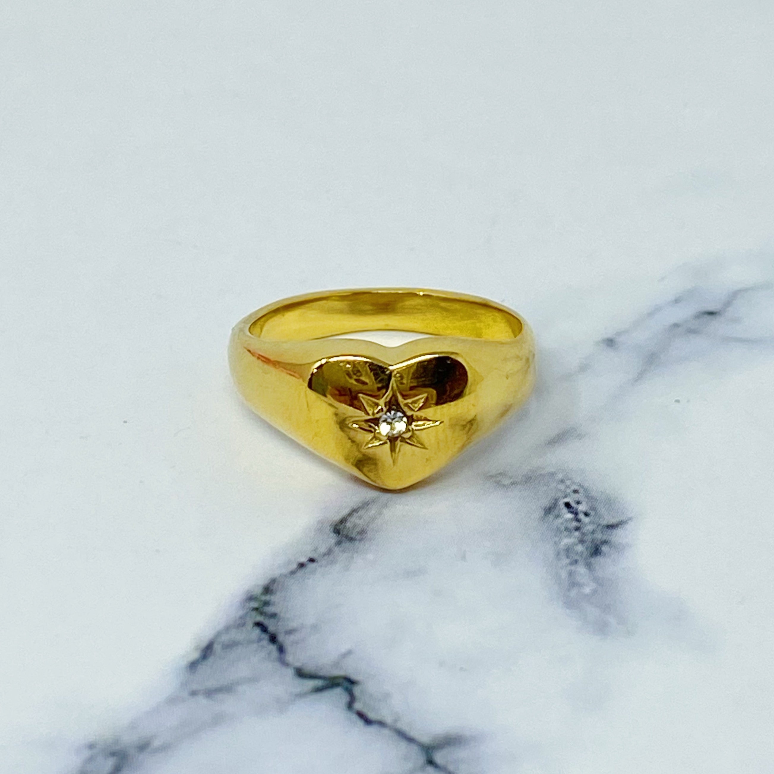 Sunburst Heart Signet Ring featuring a heart shape design with a cubic zirconia centerpiece, crafted from gold-plated stainless steel.