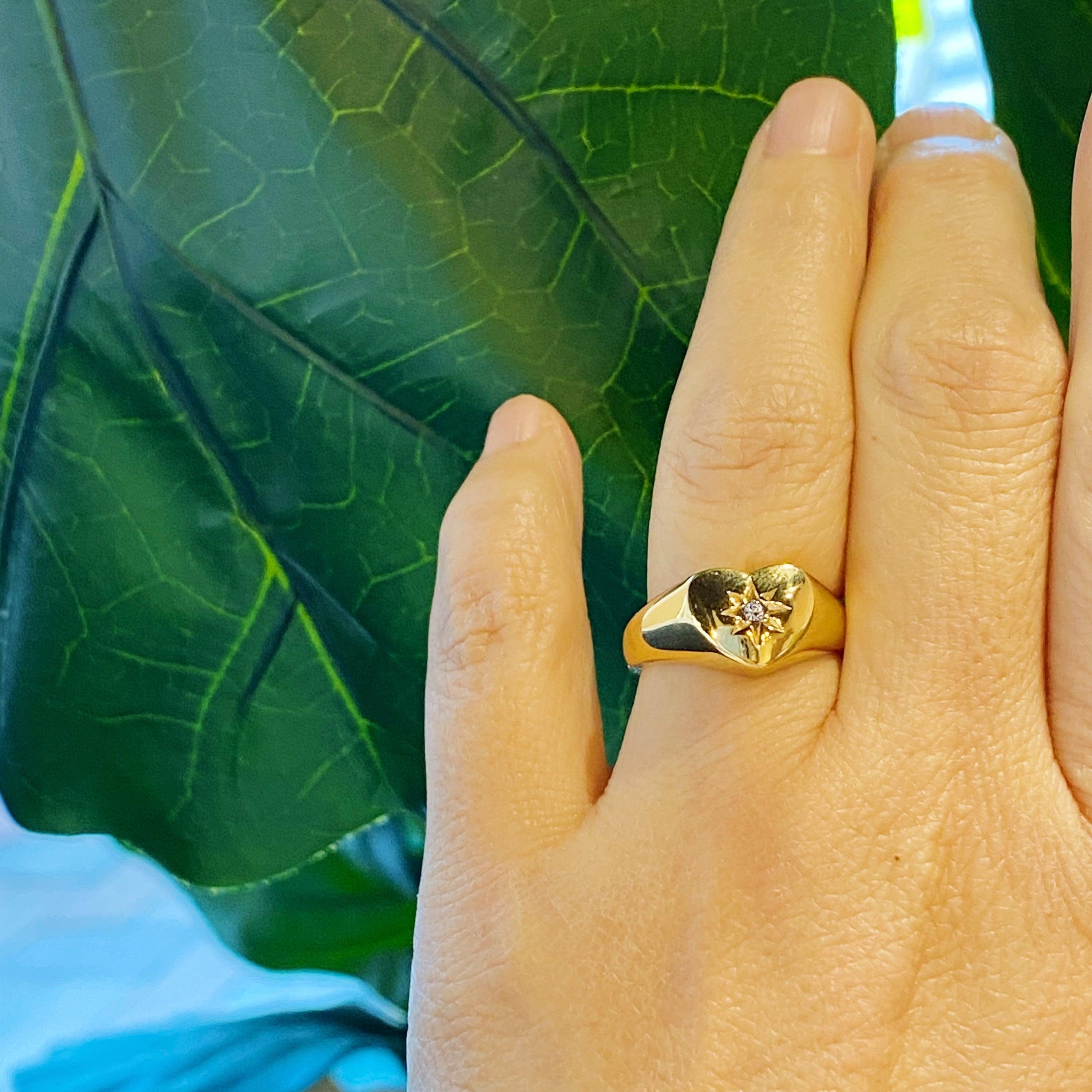 Sunburst Heart Signet Ring featuring a heart shape design with a cubic zirconia centerpiece, crafted from gold-plated stainless steel.