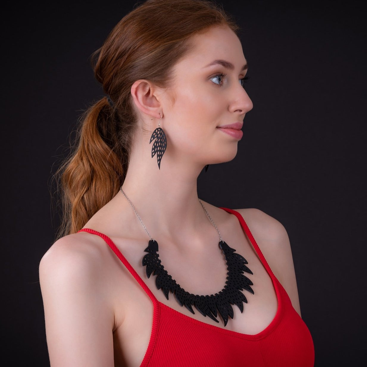 Handcrafted Sunburst Recycled Rubber Earrings featuring unique designs made from upcycled inner tubes with sterling silver hooks.