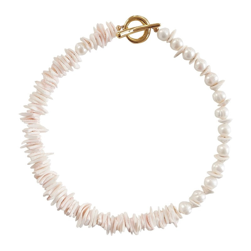 Sunlit Seashells Pink and White Beach Bliss Necklace featuring natural freshwater pearls, conch slices, and shells, embodying summer elegance.