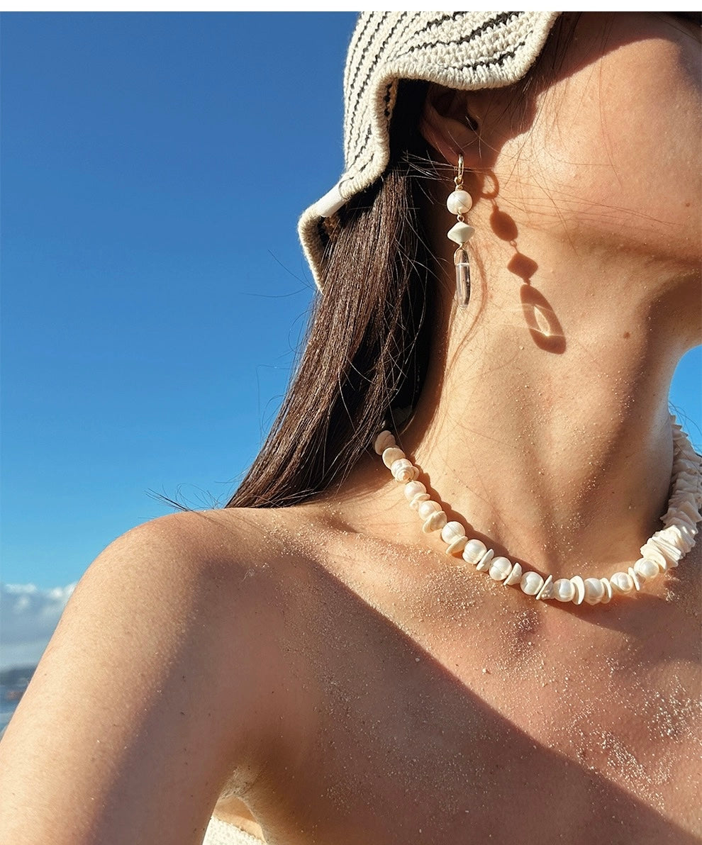 Sunlit Seashells Pink and White Beach Bliss Necklace featuring natural freshwater pearls, conch slices, and shells, embodying summer elegance.