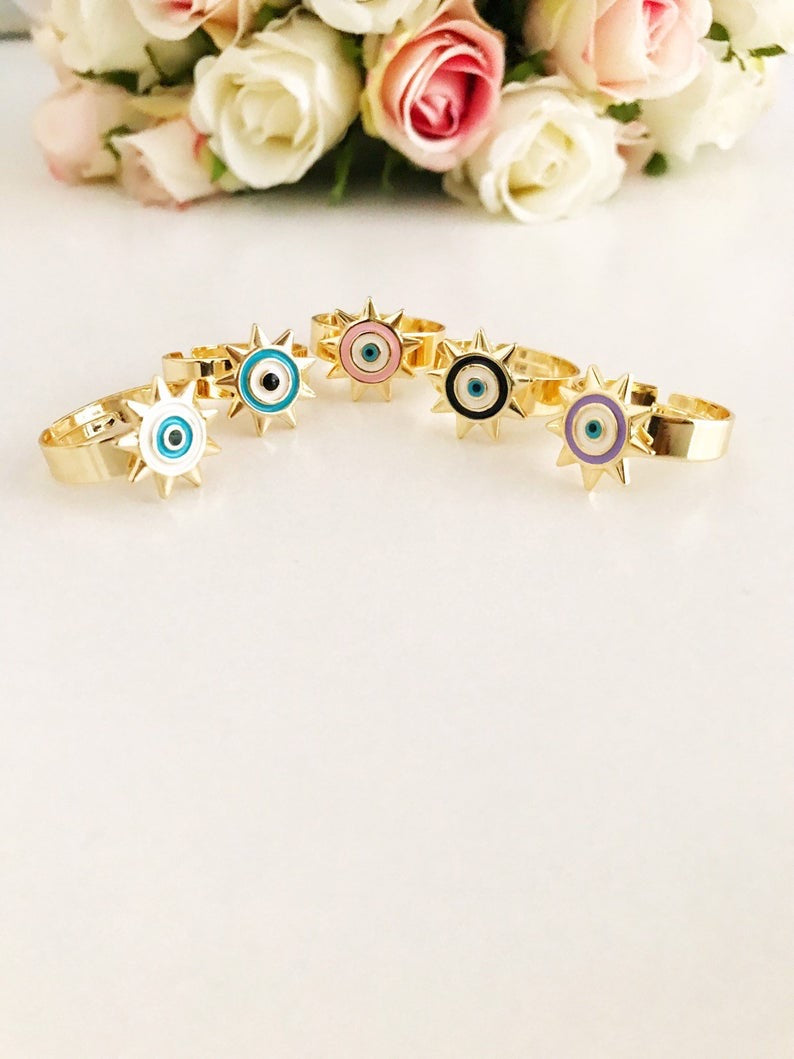 Sunny Evil Eye Ring featuring adjustable design and colorful evil eye beads in blue, turquoise, white, pink, and purple.