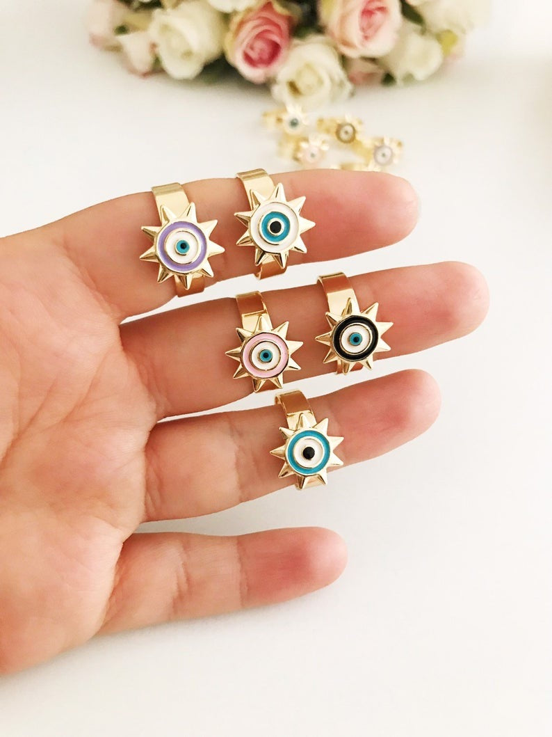 Sunny Evil Eye Ring featuring adjustable design and colorful evil eye beads in blue, turquoise, white, pink, and purple.