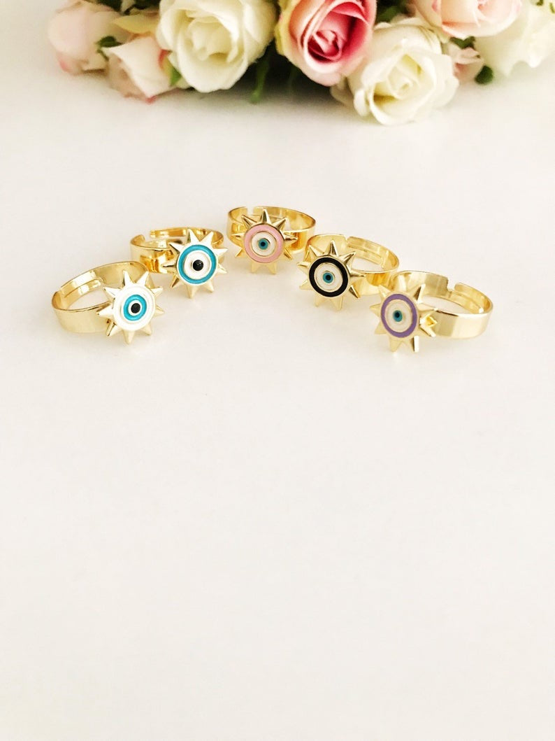 Sunny Evil Eye Ring featuring adjustable design and colorful evil eye beads in blue, turquoise, white, pink, and purple.