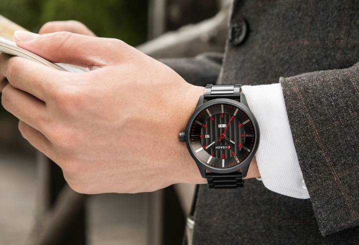 SURREAL METAL TIMEPIECE I 550733, a stylish quartz wristwatch with red accents and stainless steel band.