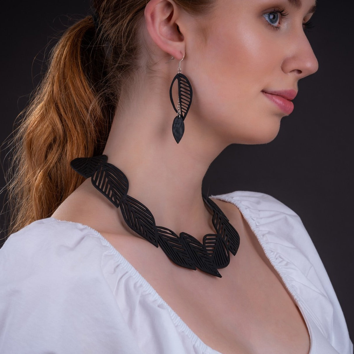 Sweet Cherry Recycled Rubber Leaf Necklace featuring handcrafted leaf design made from upcycled inner tubes, elegantly displayed in a luxury gift box.