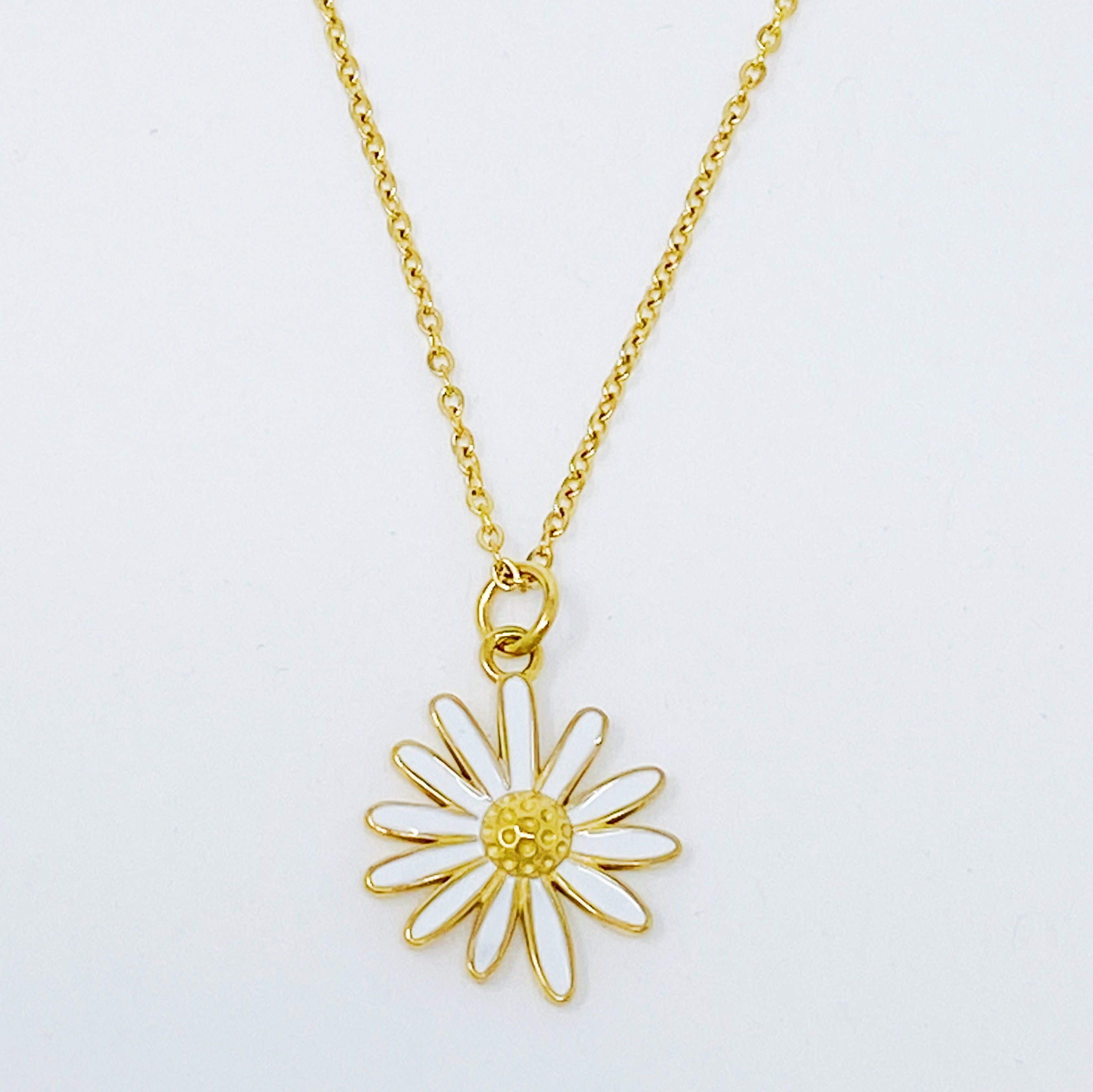 Sweet Daisy Necklace featuring a daisy pendant with CZ stones on a gold plated chain.