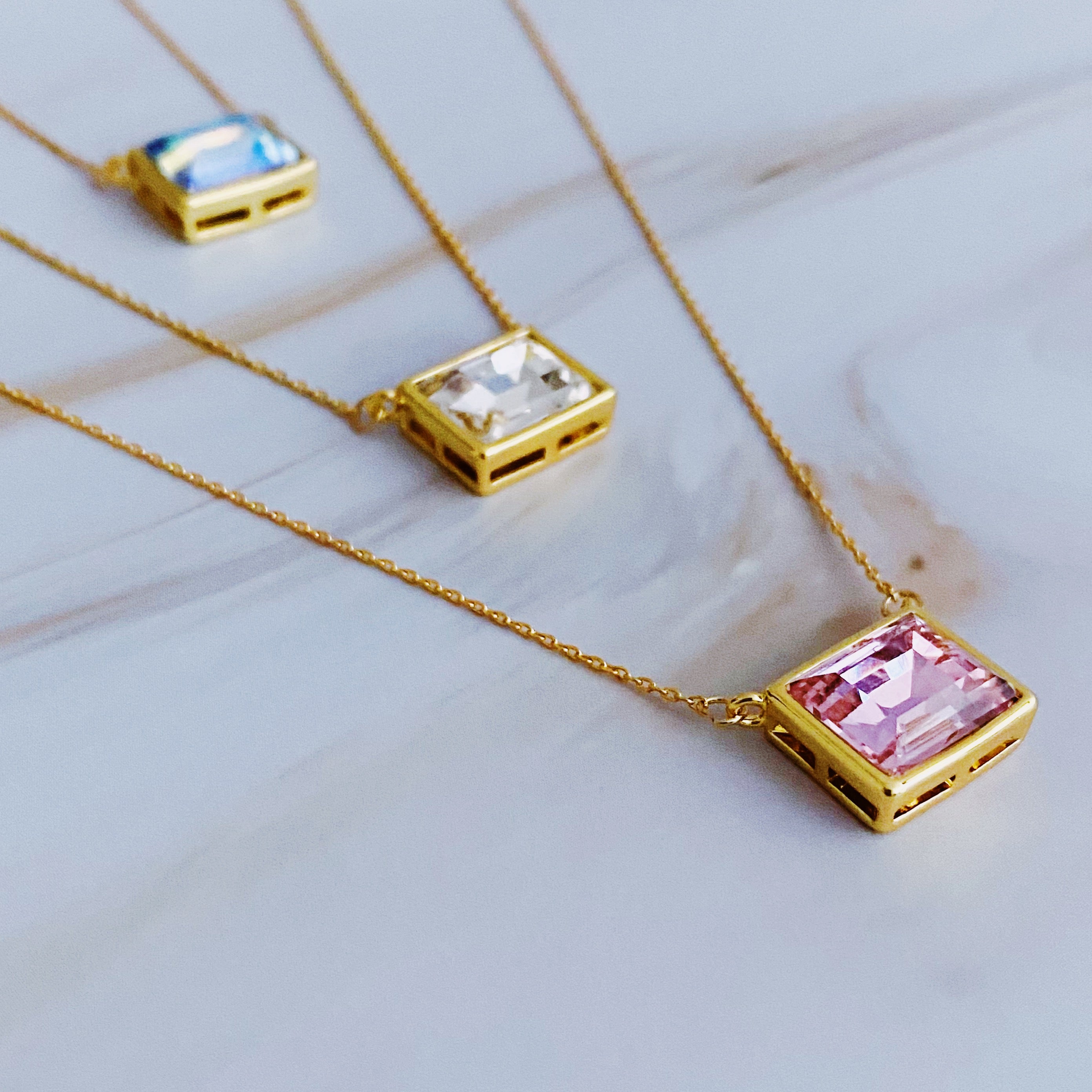 Sweet Square Pendant Necklace featuring a sparkling square pendant on a dainty gold chain.