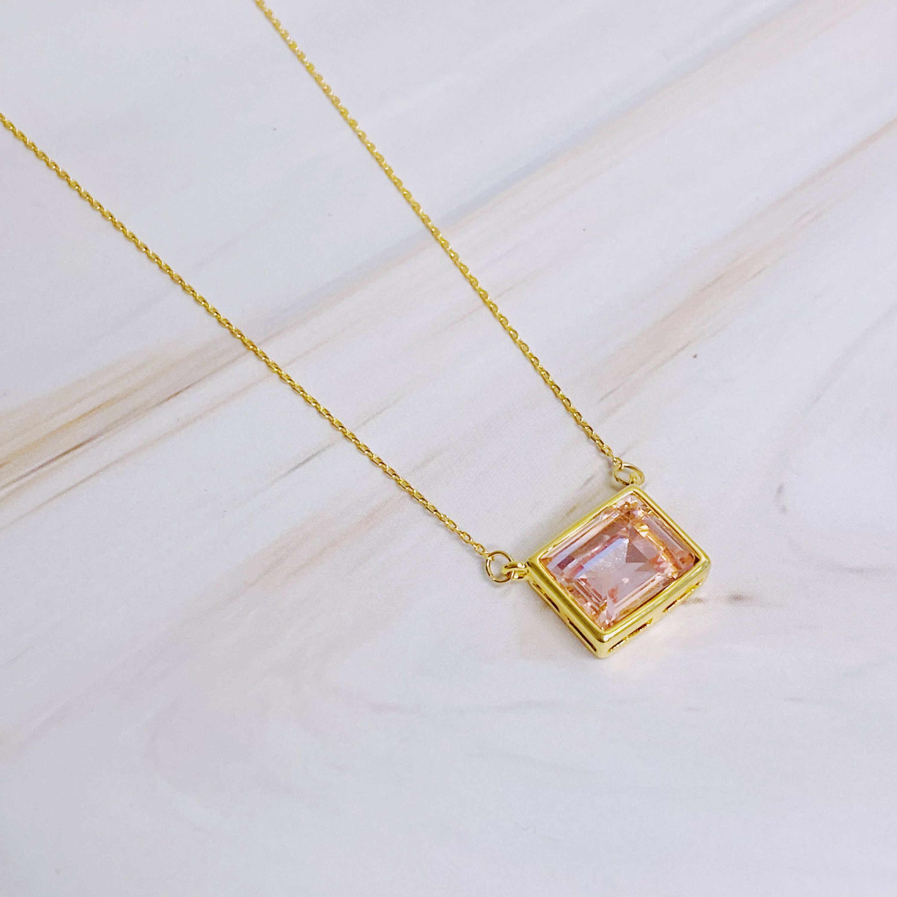 Sweet Square Pendant Necklace featuring a sparkling square pendant on a dainty gold chain.