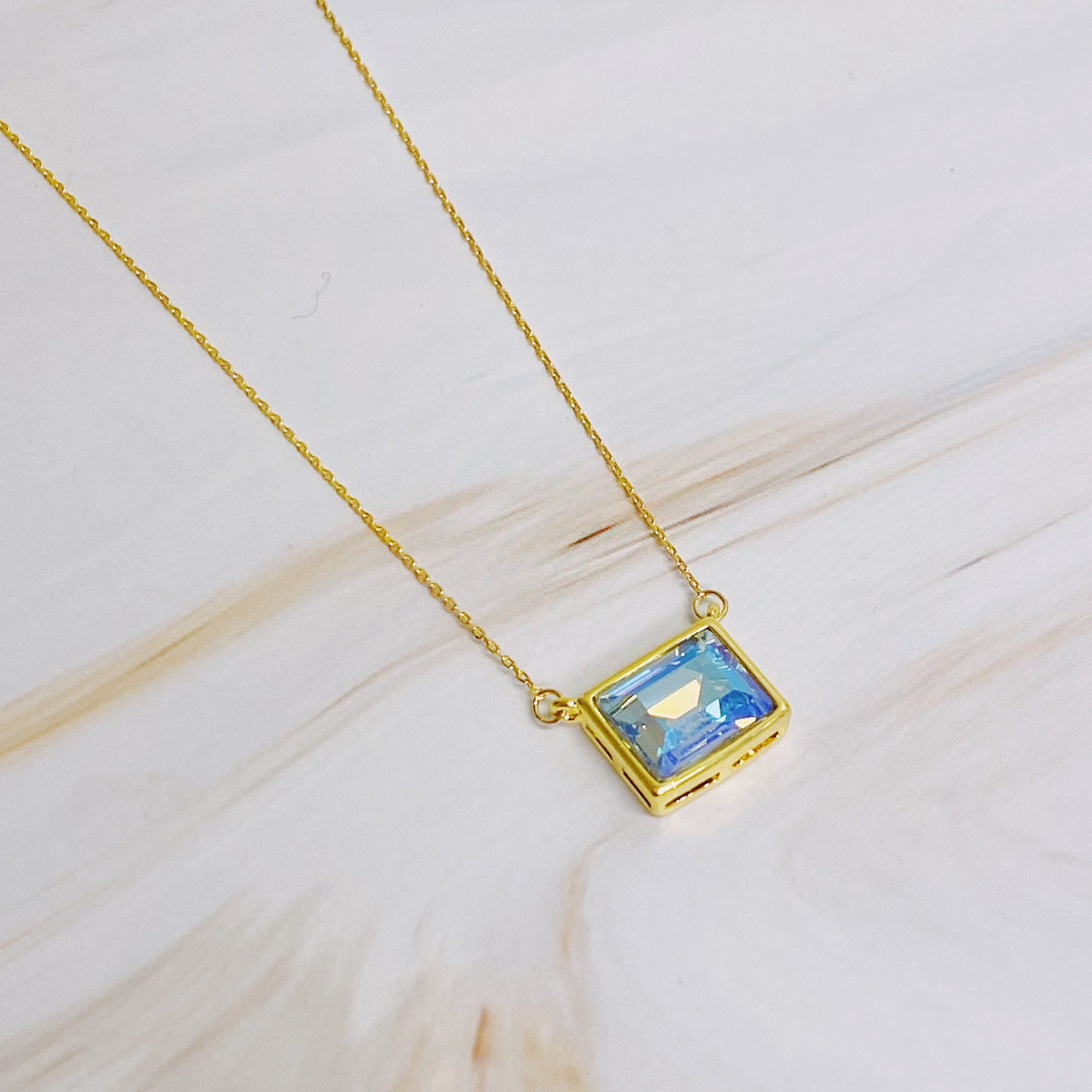 Sweet Square Pendant Necklace featuring a sparkling square pendant on a dainty gold chain.