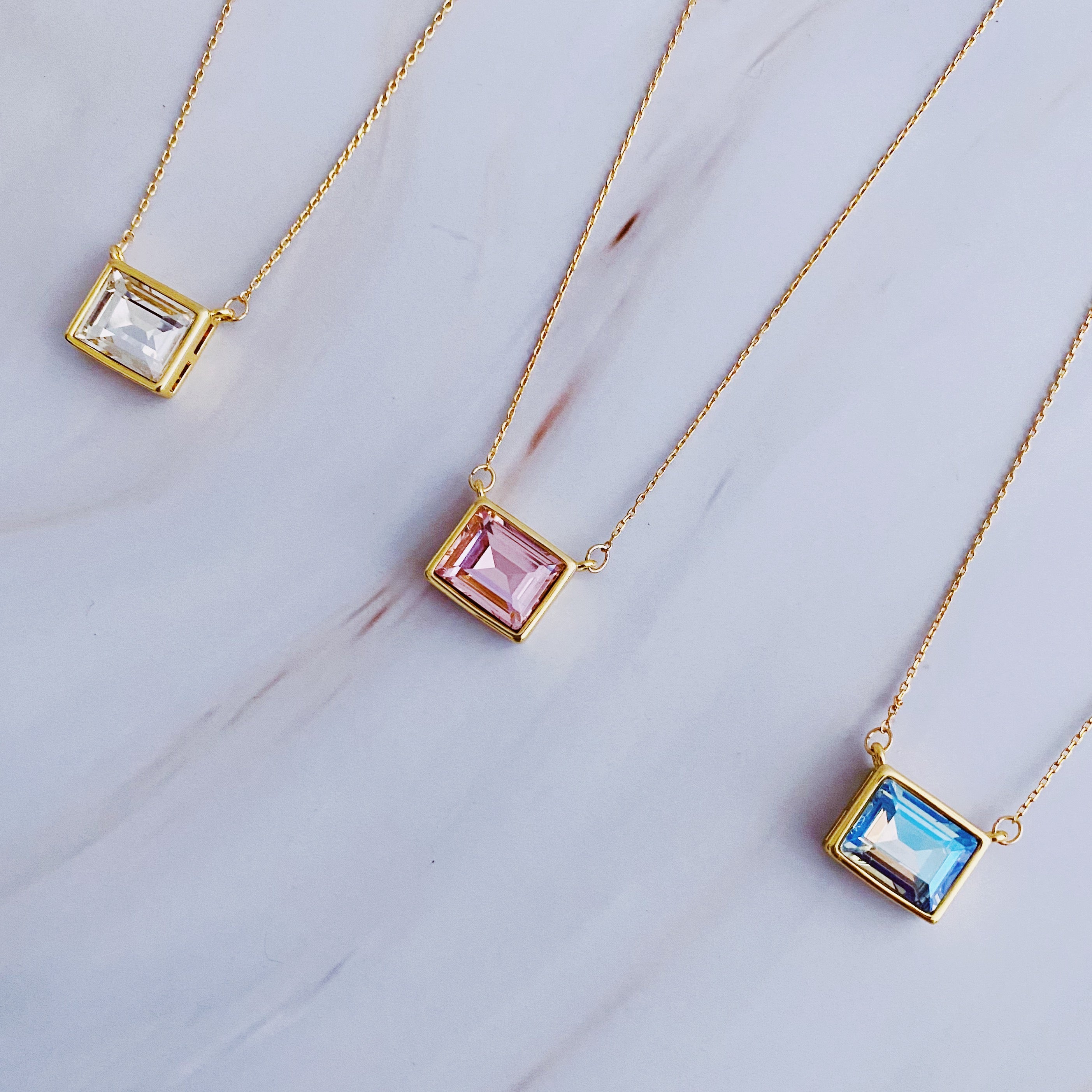 Sweet Square Pendant Necklace featuring a sparkling square pendant on a dainty gold chain.