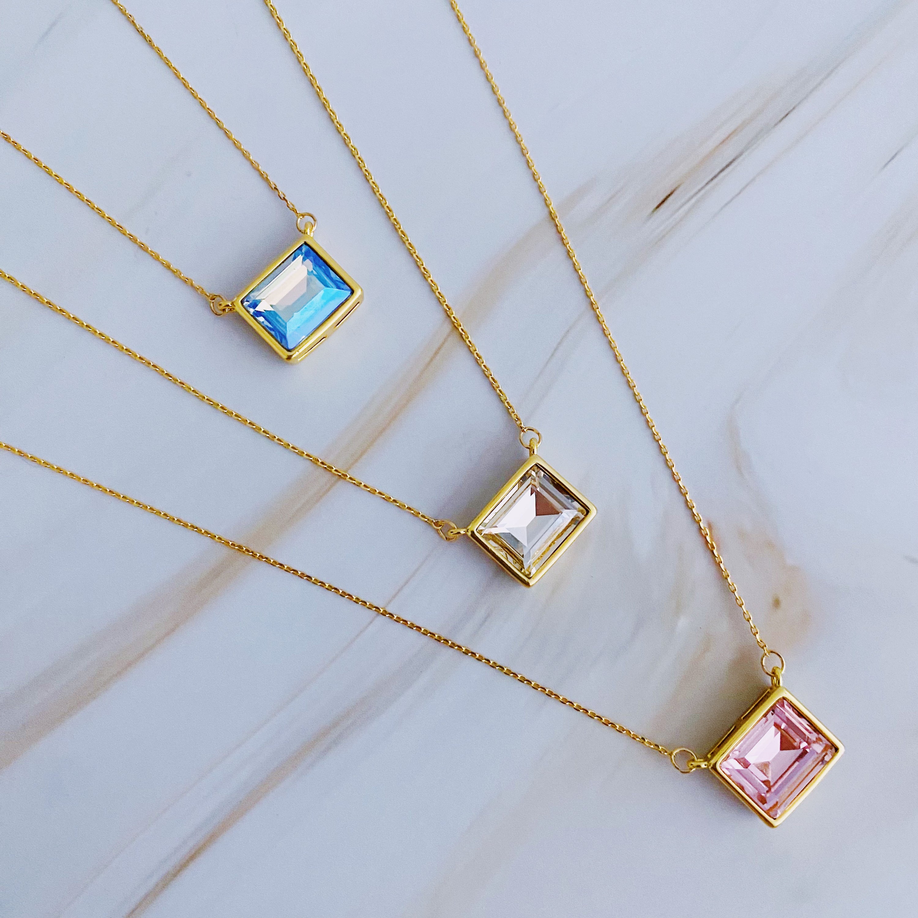 Sweet Square Pendant Necklace featuring a sparkling square pendant on a dainty gold chain.