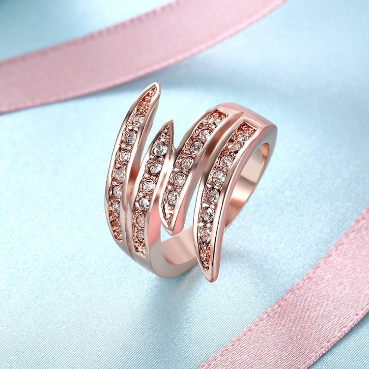 Elegant Swirl Cocktail Ring in 14K Rose Gold with sparkling crystals, showcasing a unique swirl design.