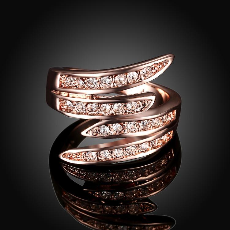 Elegant Swirl Cocktail Ring in 14K Rose Gold with sparkling crystals, showcasing a unique swirl design.