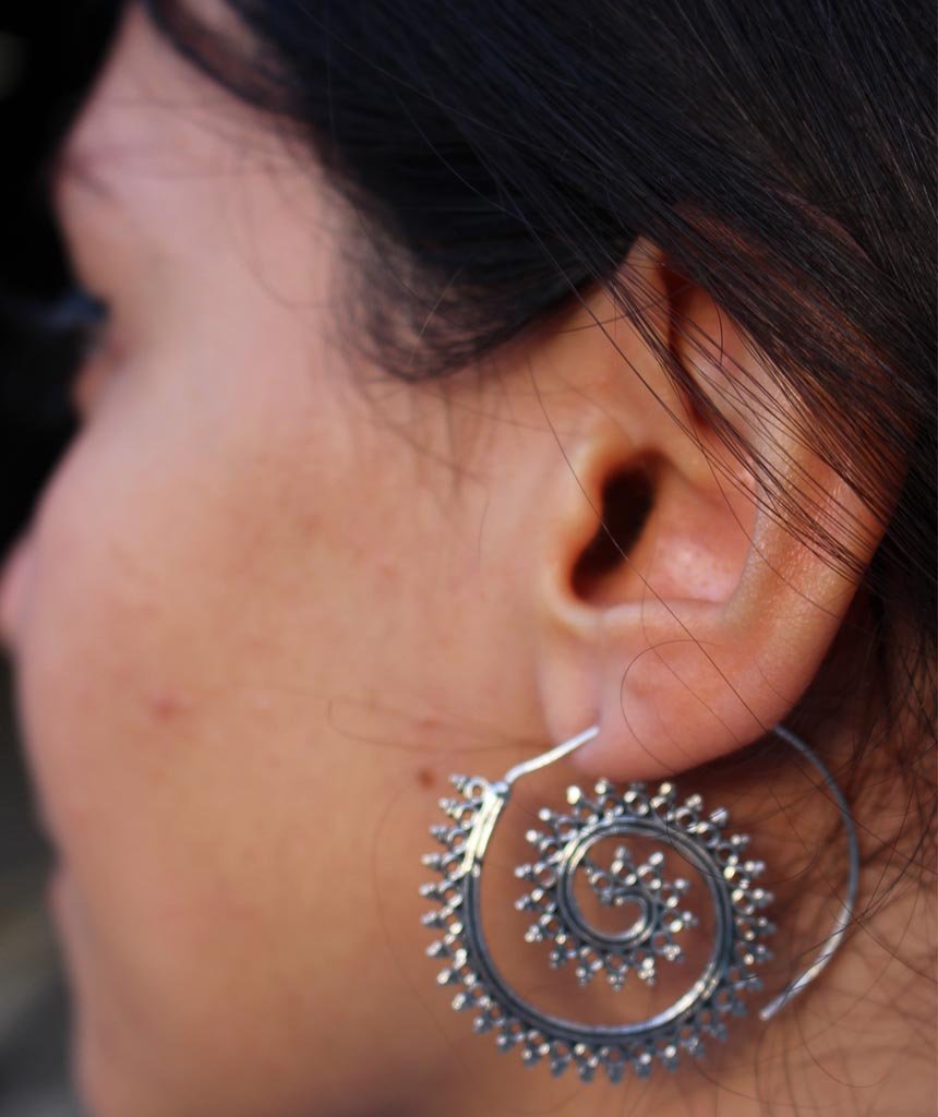 A pair of Urbiana Swivel Hoop Earrings featuring intricate bohemian design, crafted from brass and silver, perfect for sensitive skin.