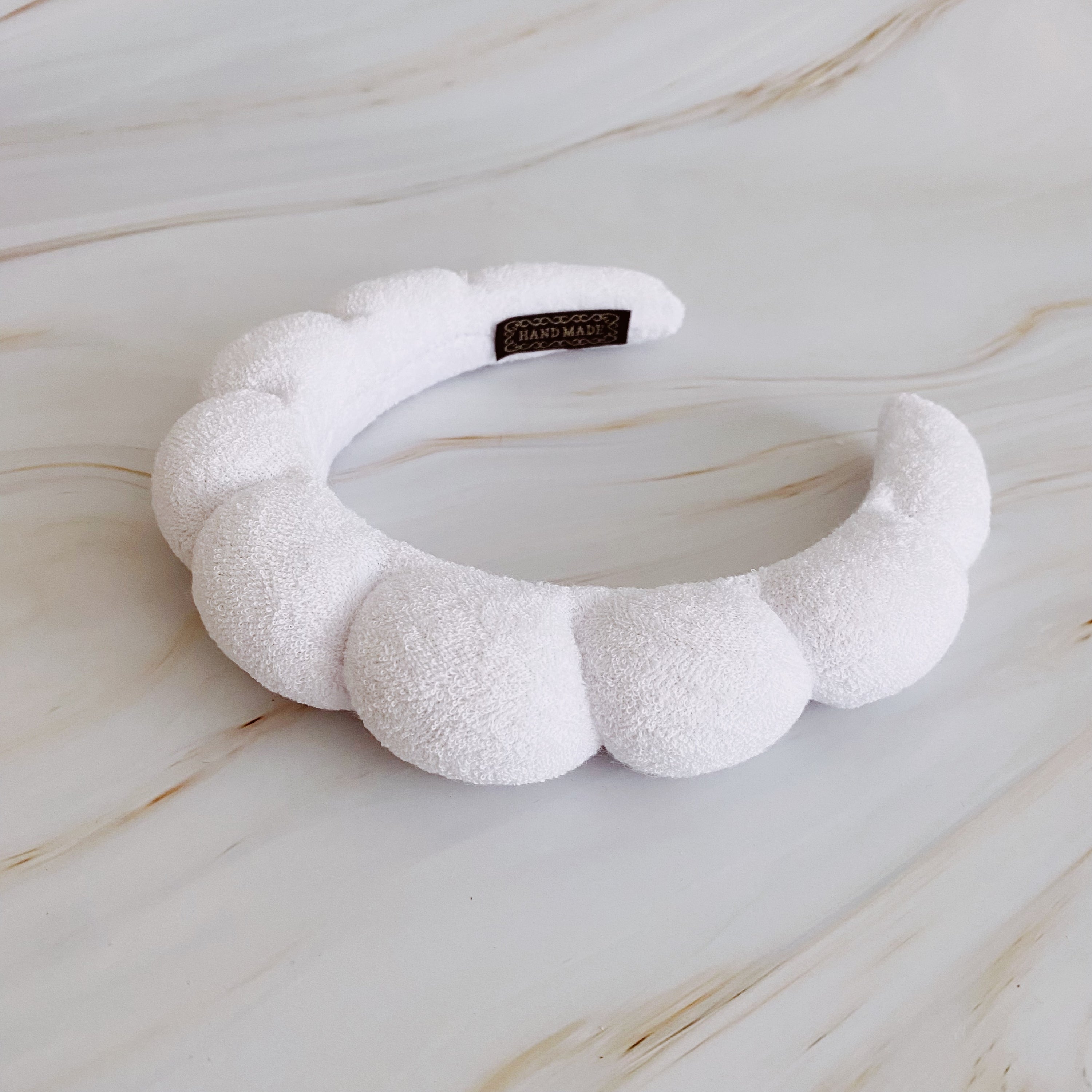 Terry Puffy Soft Headband in playful scalloped design, made of soft terry cloth fabric, perfect for casual and spa use.