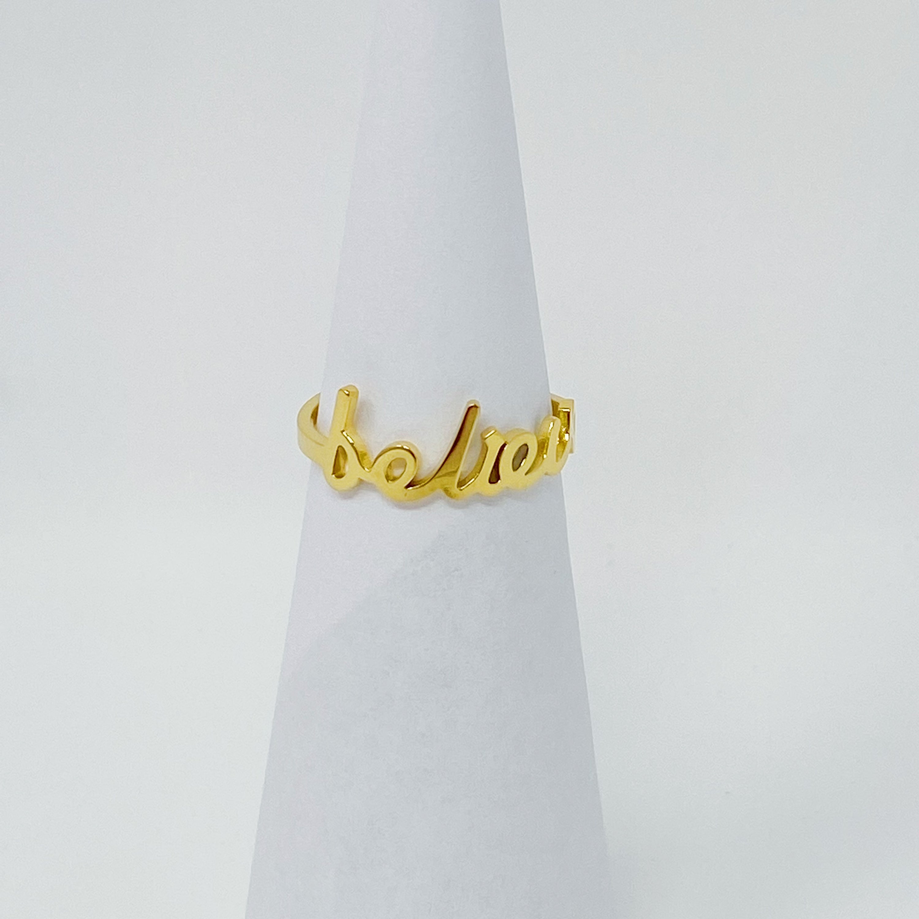 The Always Remember Ring featuring delicate script, adjustable design, and 18K gold plating on stainless steel.