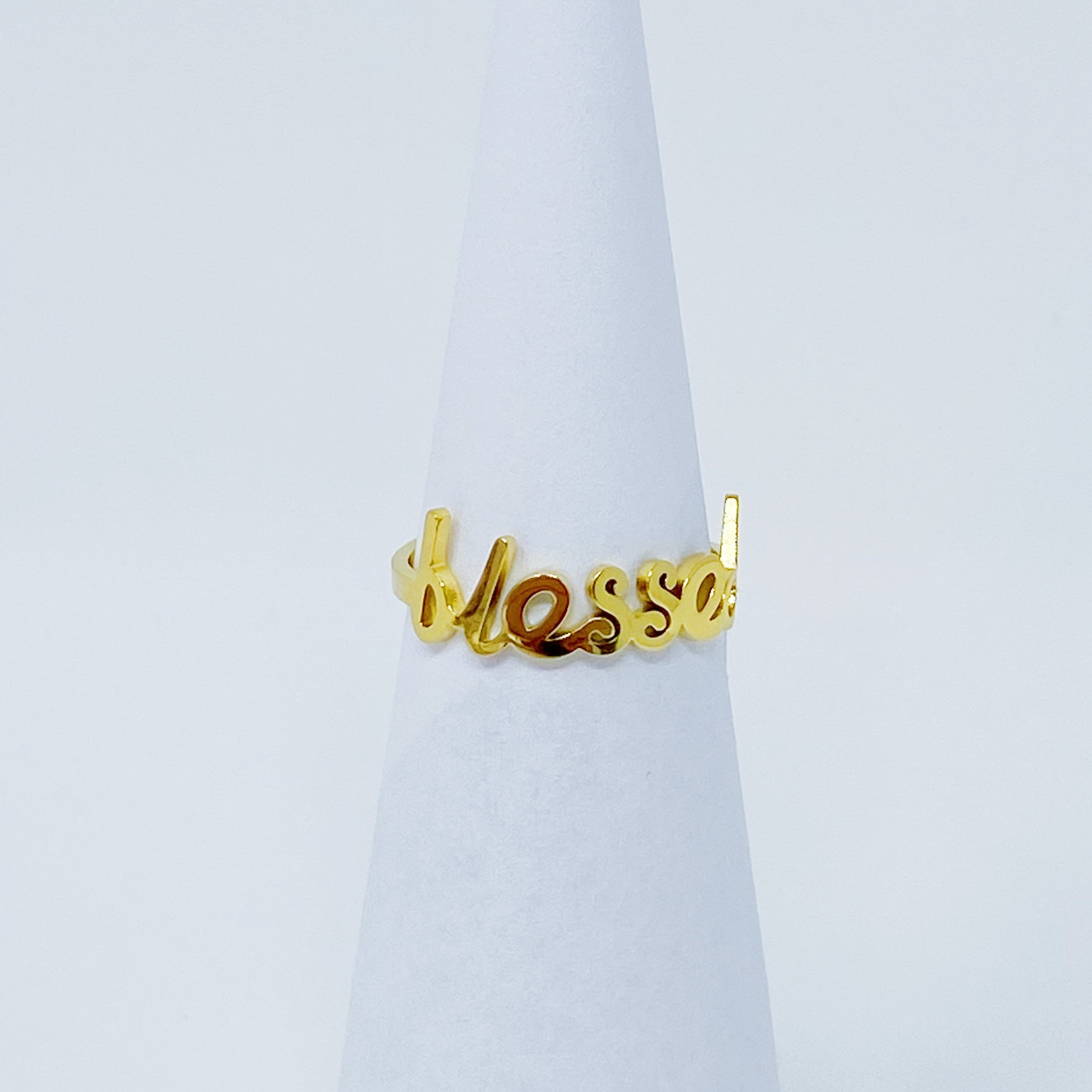 The Always Remember Ring featuring delicate script, adjustable design, and 18K gold plating on stainless steel.