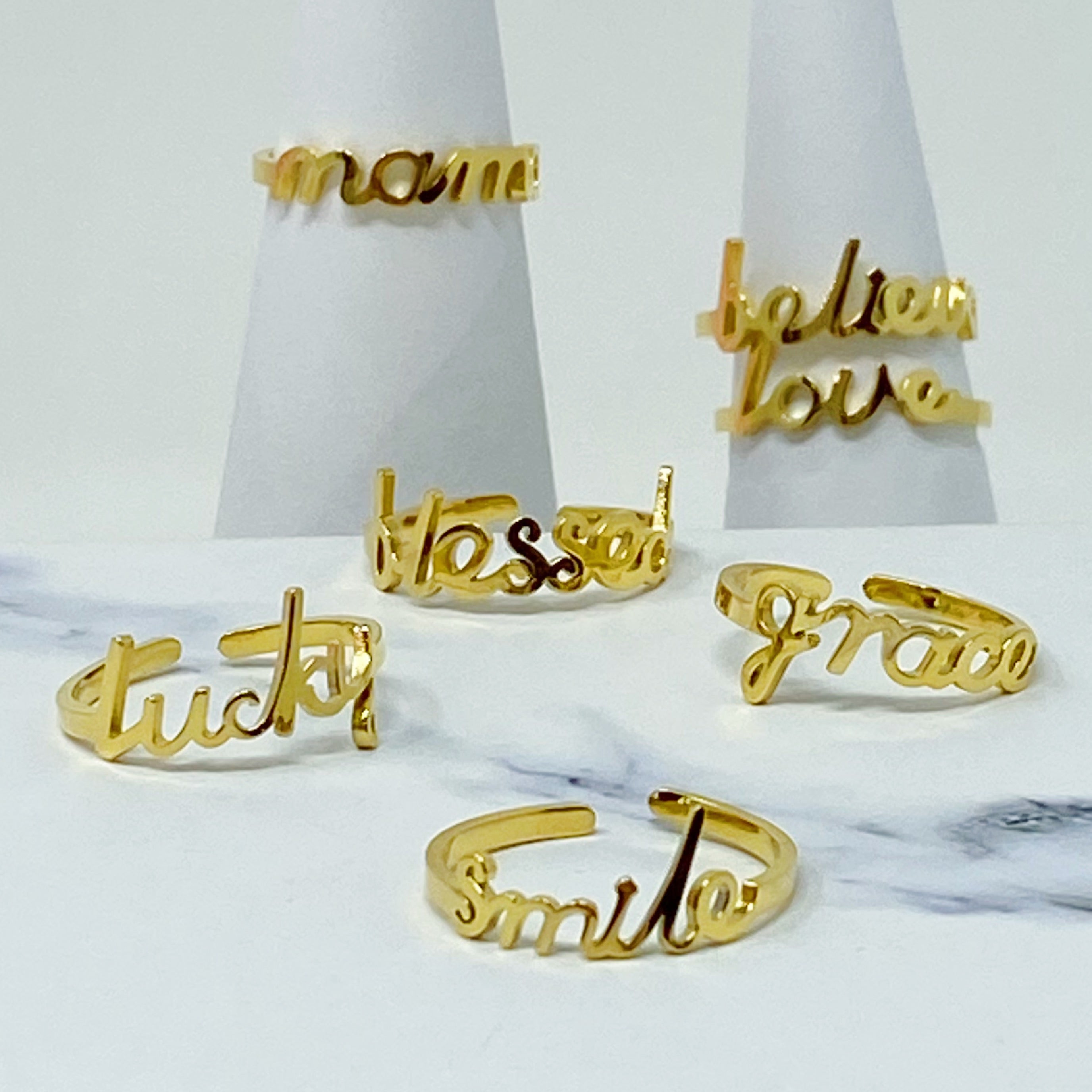 The Always Remember Ring featuring delicate script, adjustable design, and 18K gold plating on stainless steel.