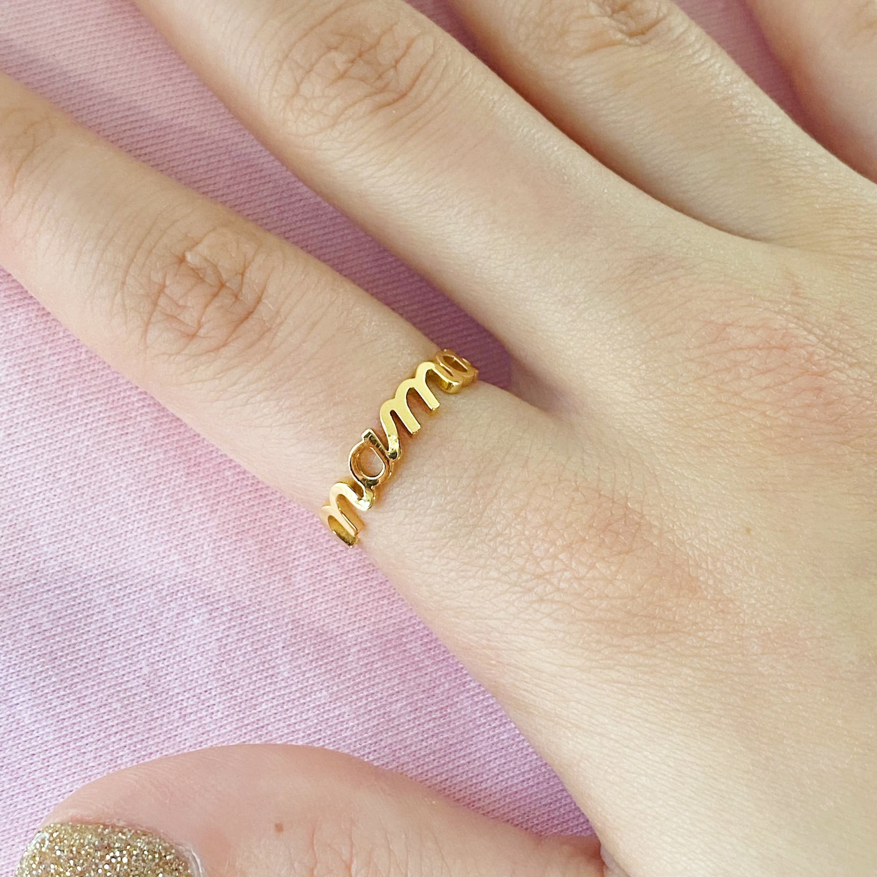 The Always Remember Ring featuring delicate script, adjustable design, and 18K gold plating on stainless steel.