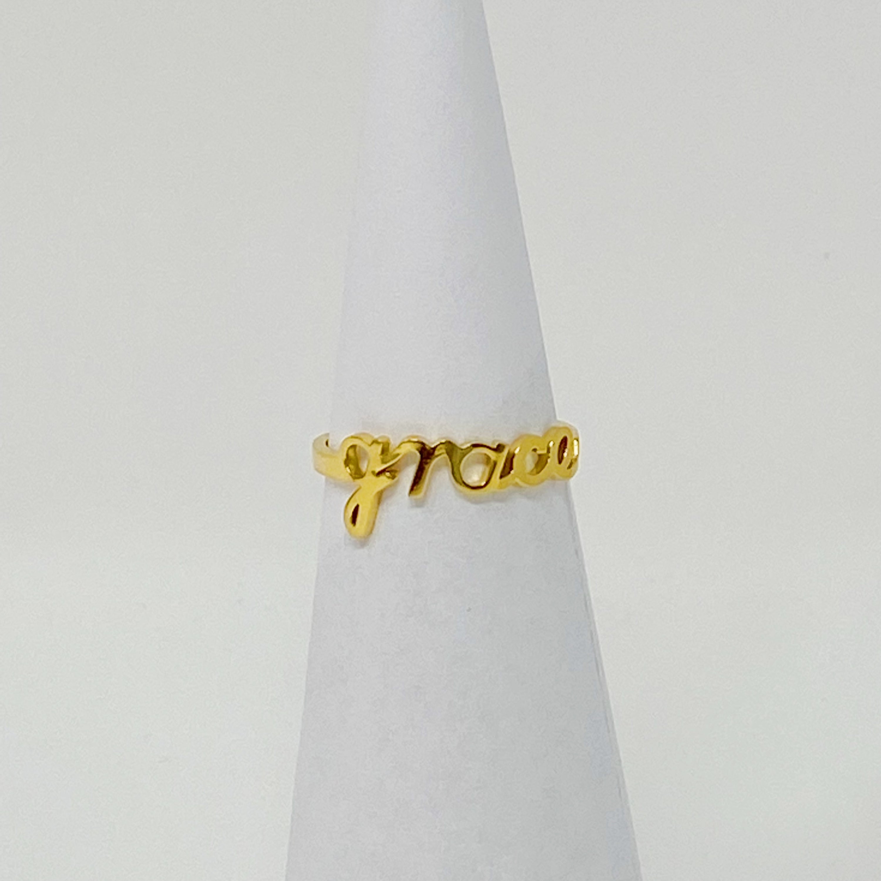 The Always Remember Ring featuring delicate script, adjustable design, and 18K gold plating on stainless steel.