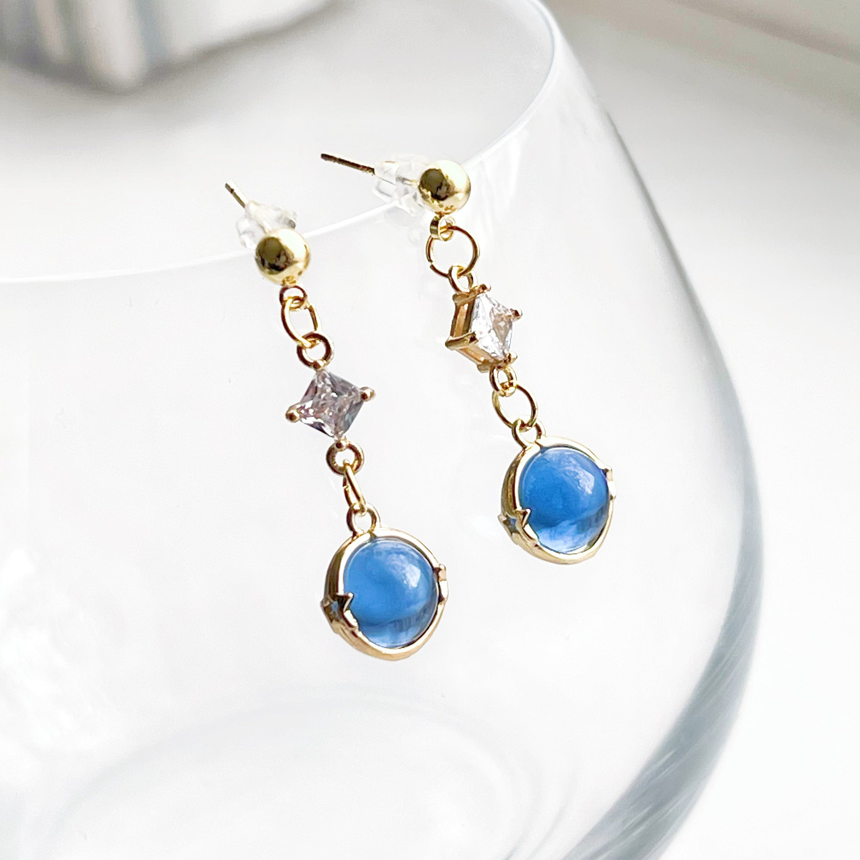 Elegant Blue Planet Neptune Drop Earrings featuring recycled glass beads and sterling silver studs, beautifully packaged in a gift box.