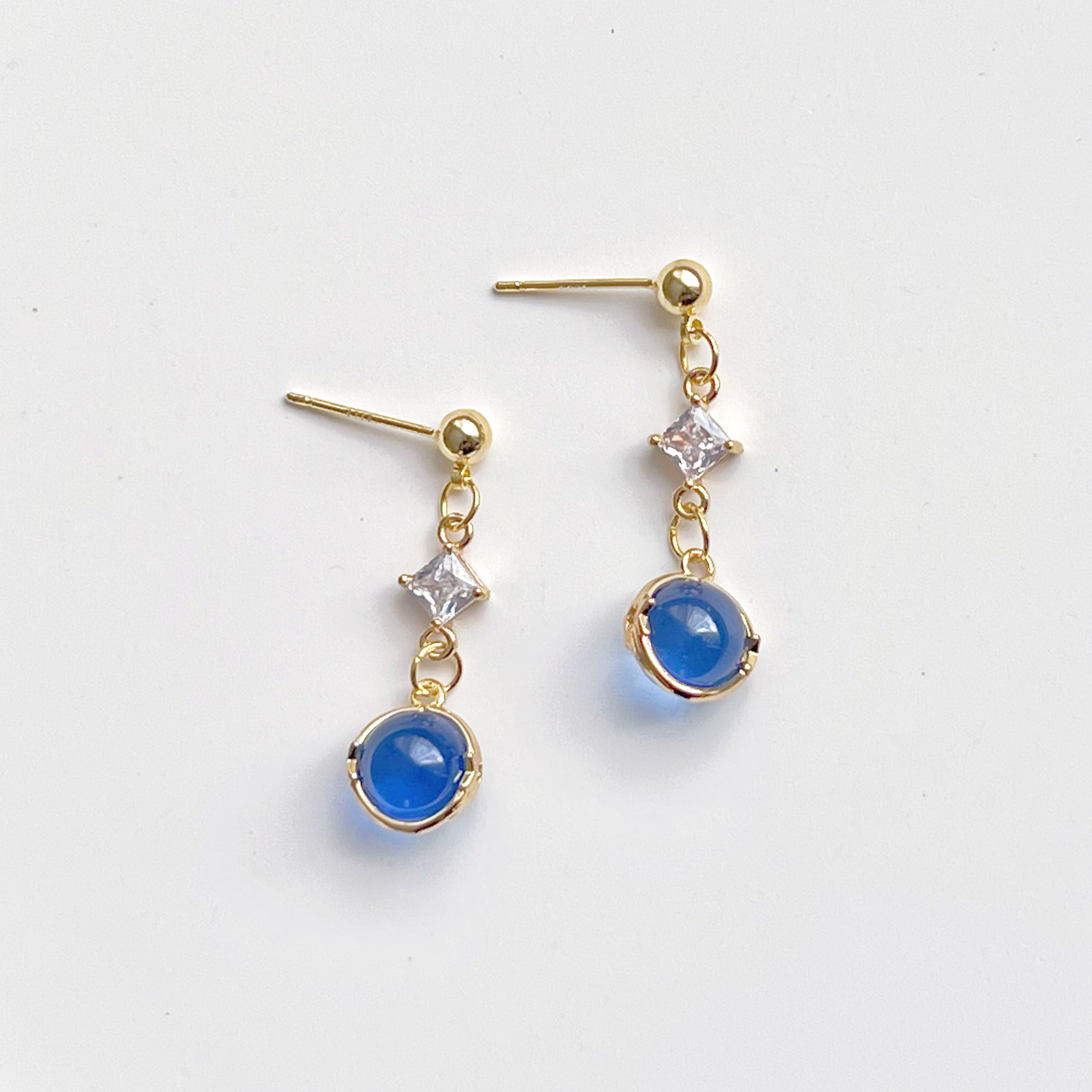 Elegant Blue Planet Neptune Drop Earrings featuring recycled glass beads and sterling silver studs, beautifully packaged in a gift box.