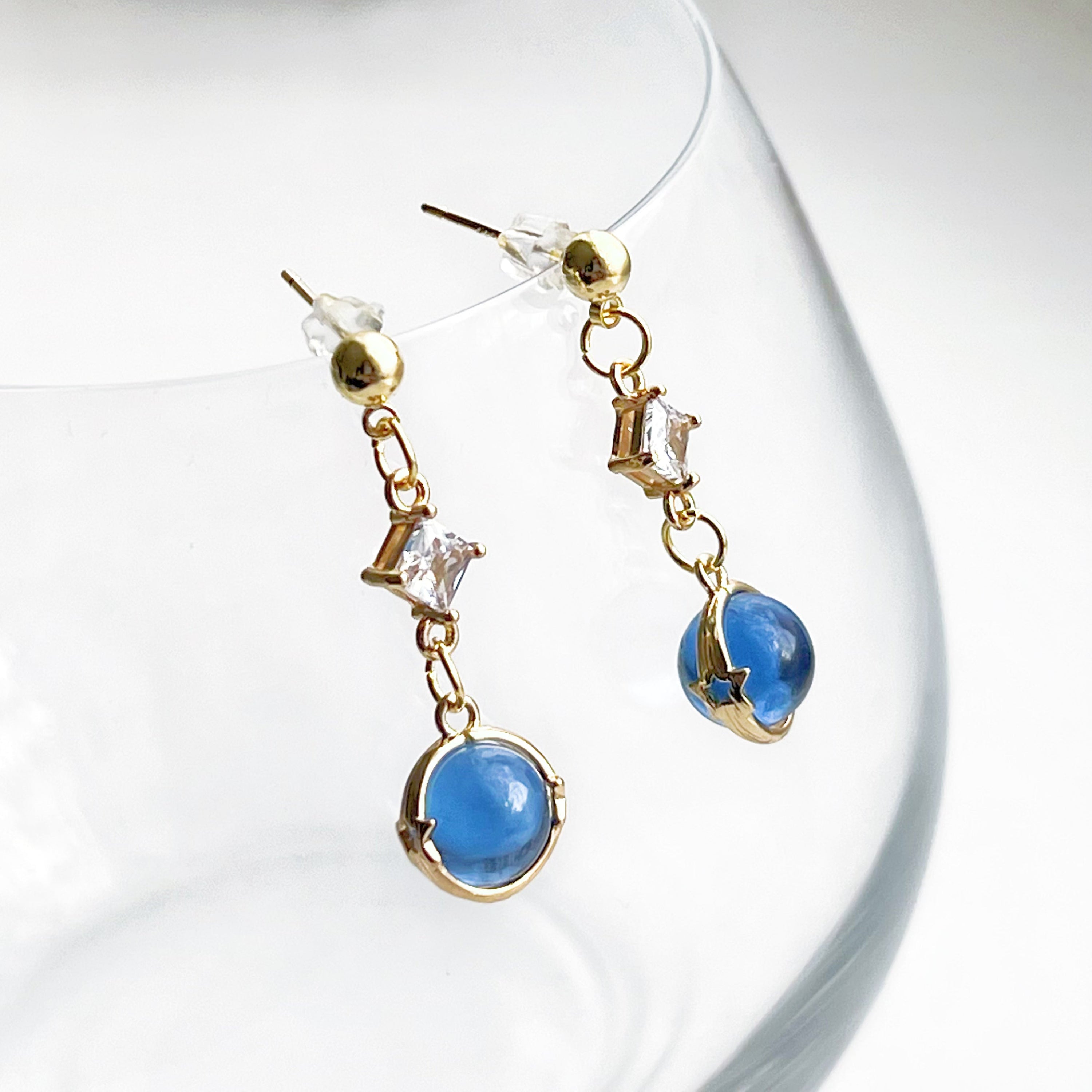 Elegant Blue Planet Neptune Drop Earrings featuring recycled glass beads and sterling silver studs, beautifully packaged in a gift box.