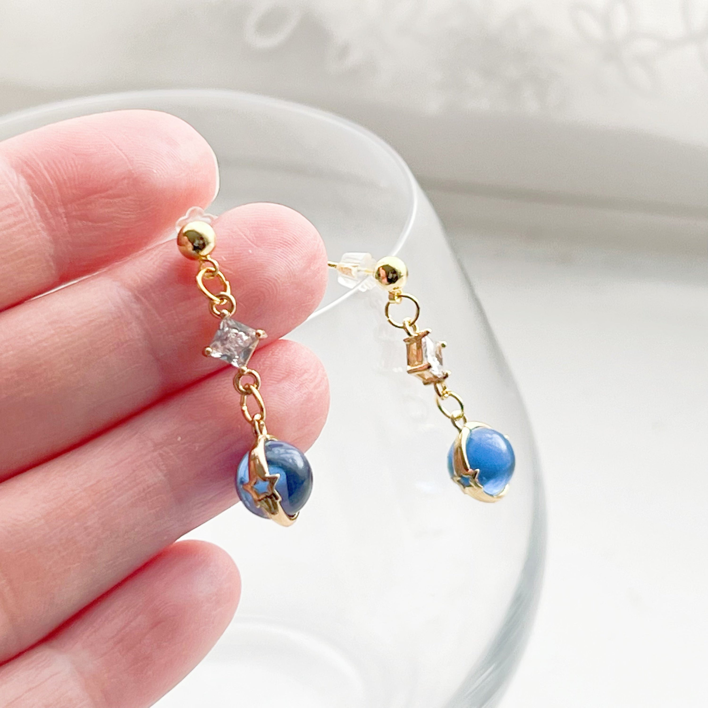 Elegant Blue Planet Neptune Drop Earrings featuring recycled glass beads and sterling silver studs, beautifully packaged in a gift box.