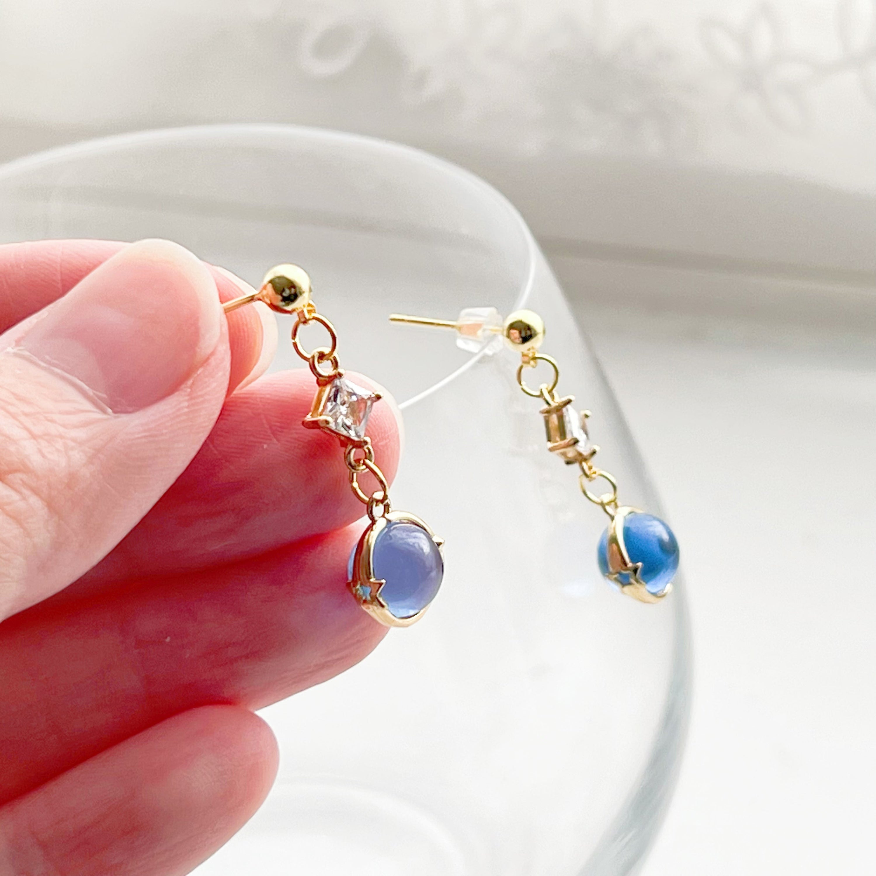 Elegant Blue Planet Neptune Drop Earrings featuring recycled glass beads and sterling silver studs, beautifully packaged in a gift box.