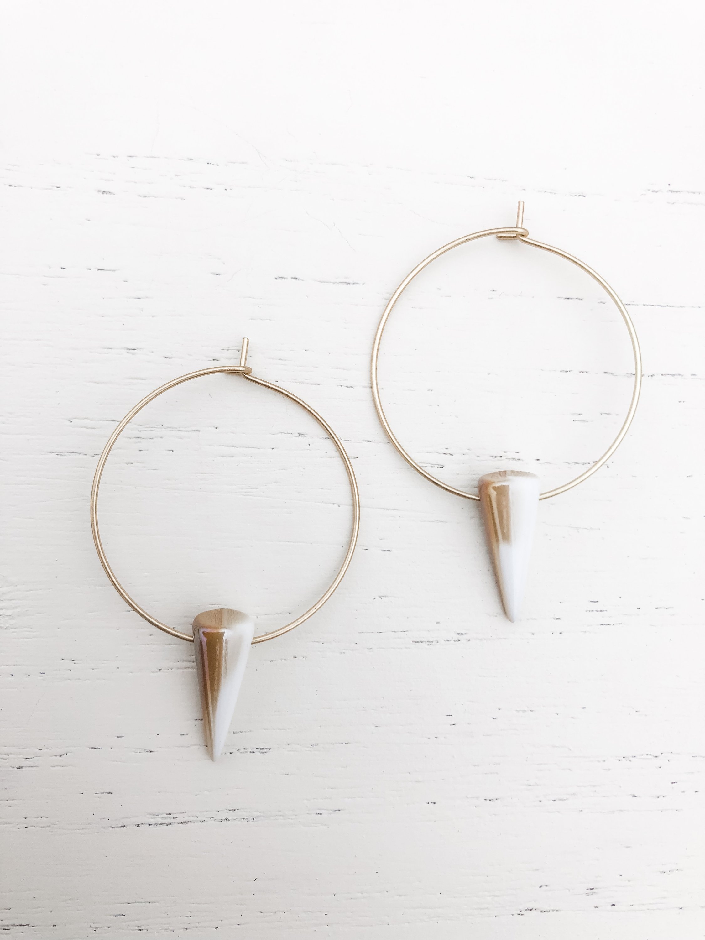 Gold plated hoop earrings featuring tan and beige Czech glass details, measuring approximately 1-3/4 inches in length.