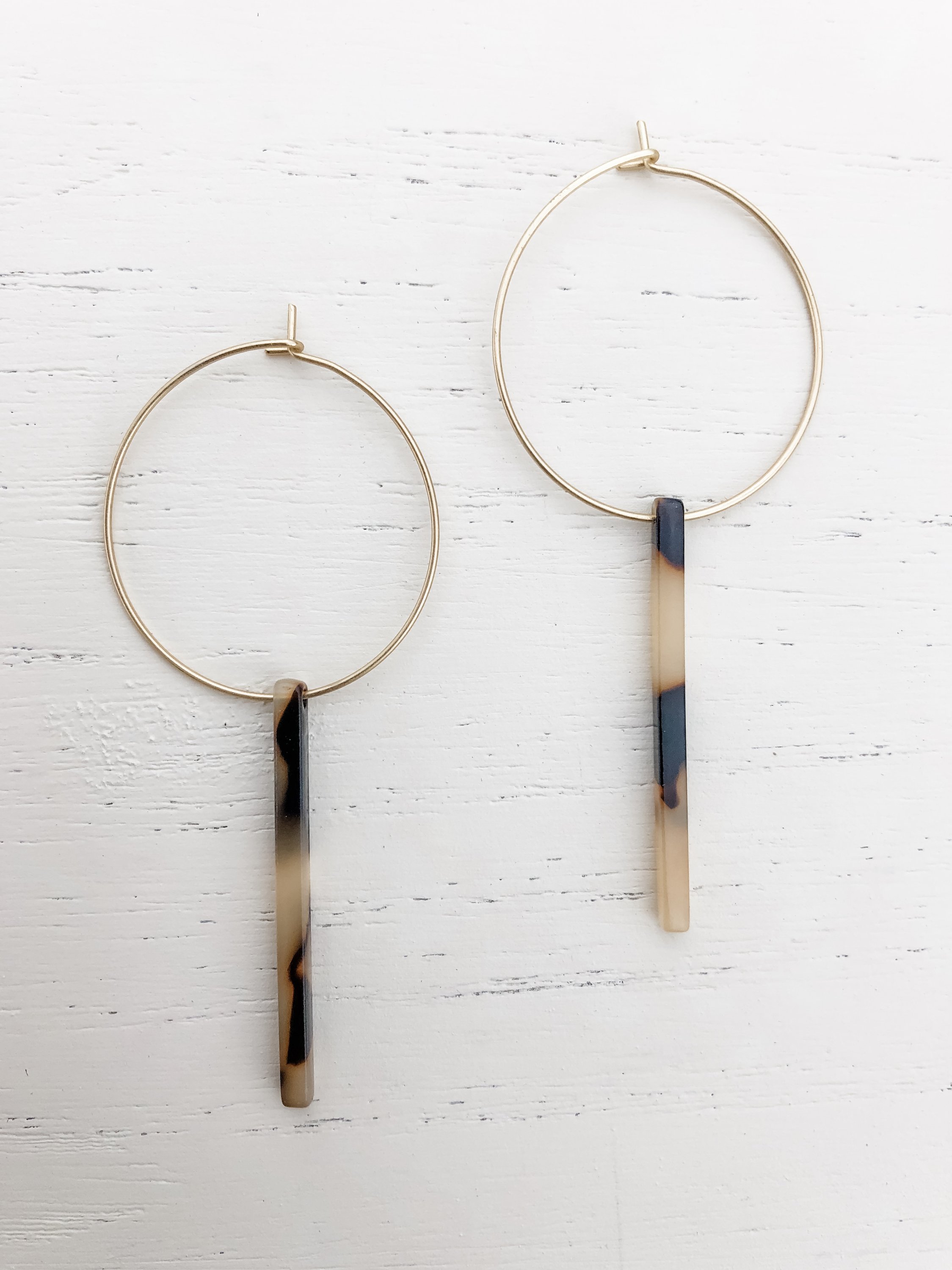 Gold plated hoop earrings with light tortoise resin detail, measuring 2-5/8 inches in length.