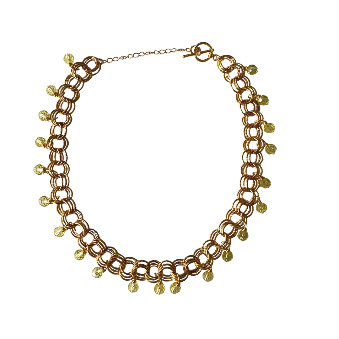 The Christina Choker in Jonquil featuring Czech glass beads and metal links, elegantly displayed on a neutral background.