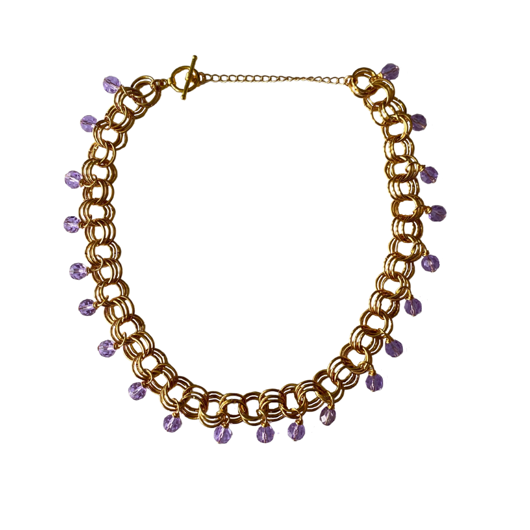 The Christina Choker in Violet featuring Czech glass beads on a delicate chain, showcasing its elegant design.