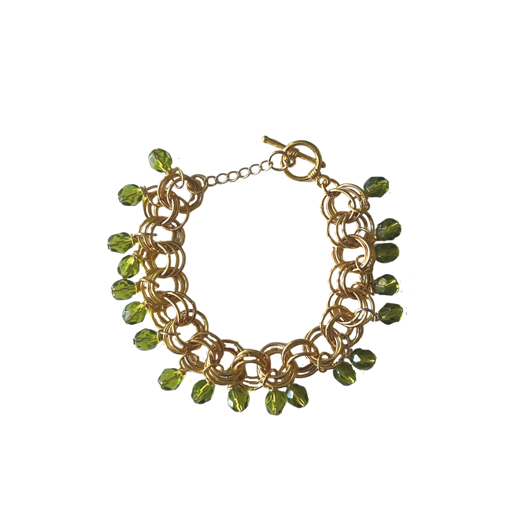 The Donna Bracelet in Olive featuring olive Czech glass beads and premium metal links, elegantly handcrafted.