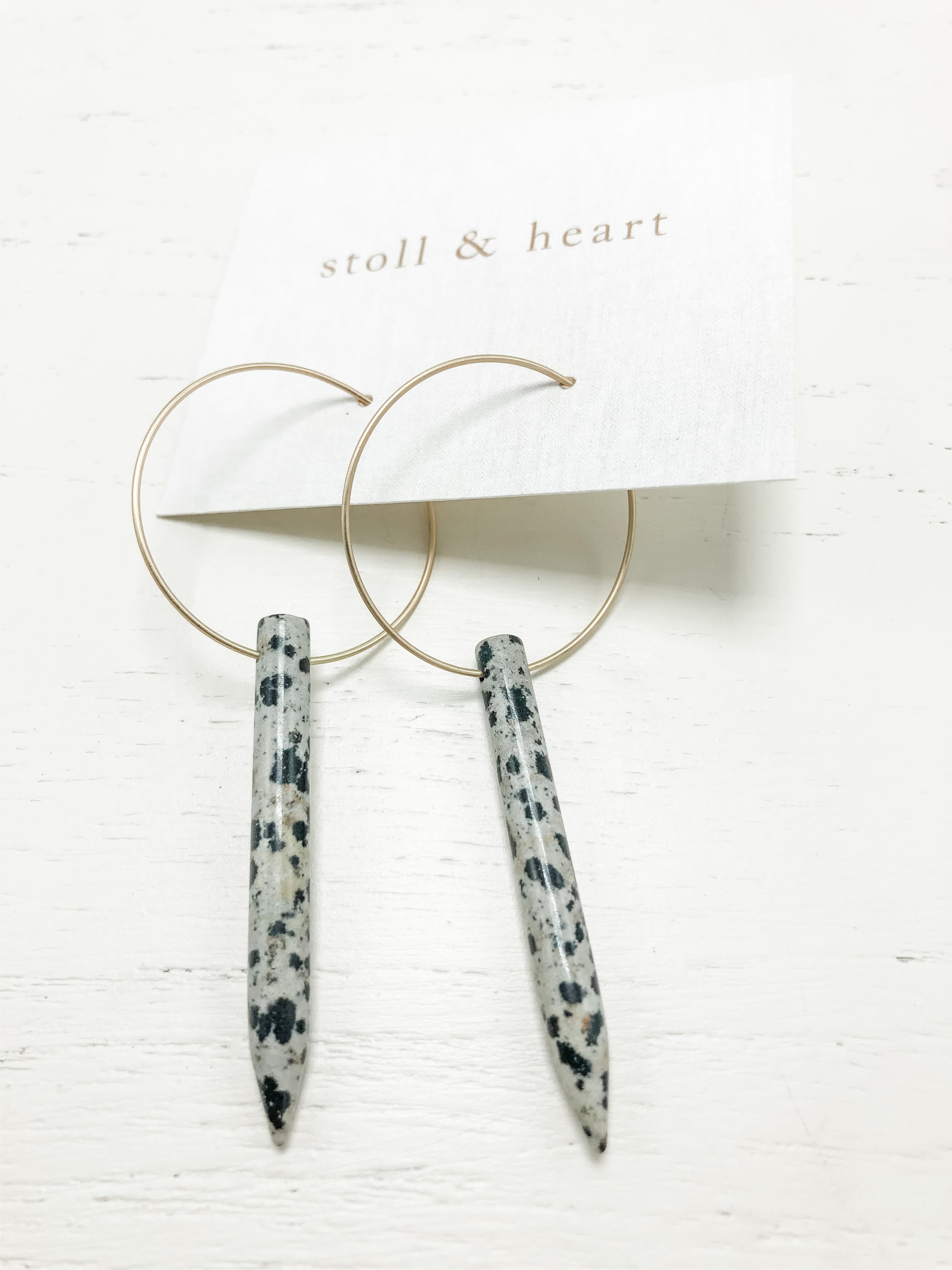 Hartley Dalmatian Jasper Spike earrings featuring gold plated hoops and opalite spikes, showcasing a unique and elegant design.