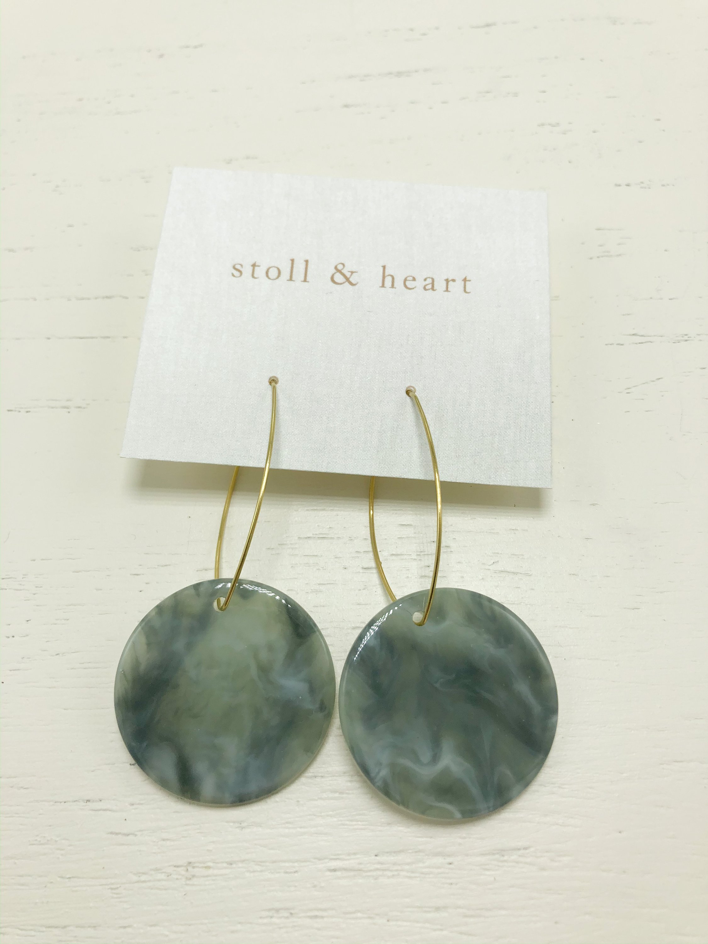 Maddy Roundies Grey/Green earrings featuring brass hoops and grey/green resin detail, measuring approximately 2-3/4 inches in length.