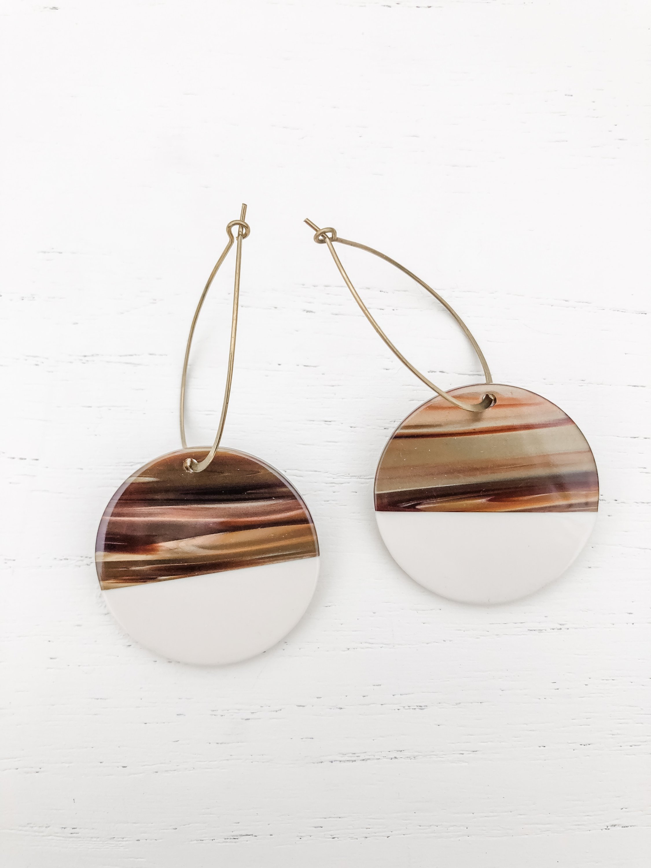 Maddy Roundies Tan earrings featuring brass hoops with tan and beige resin details, elegantly designed for stylish wear.