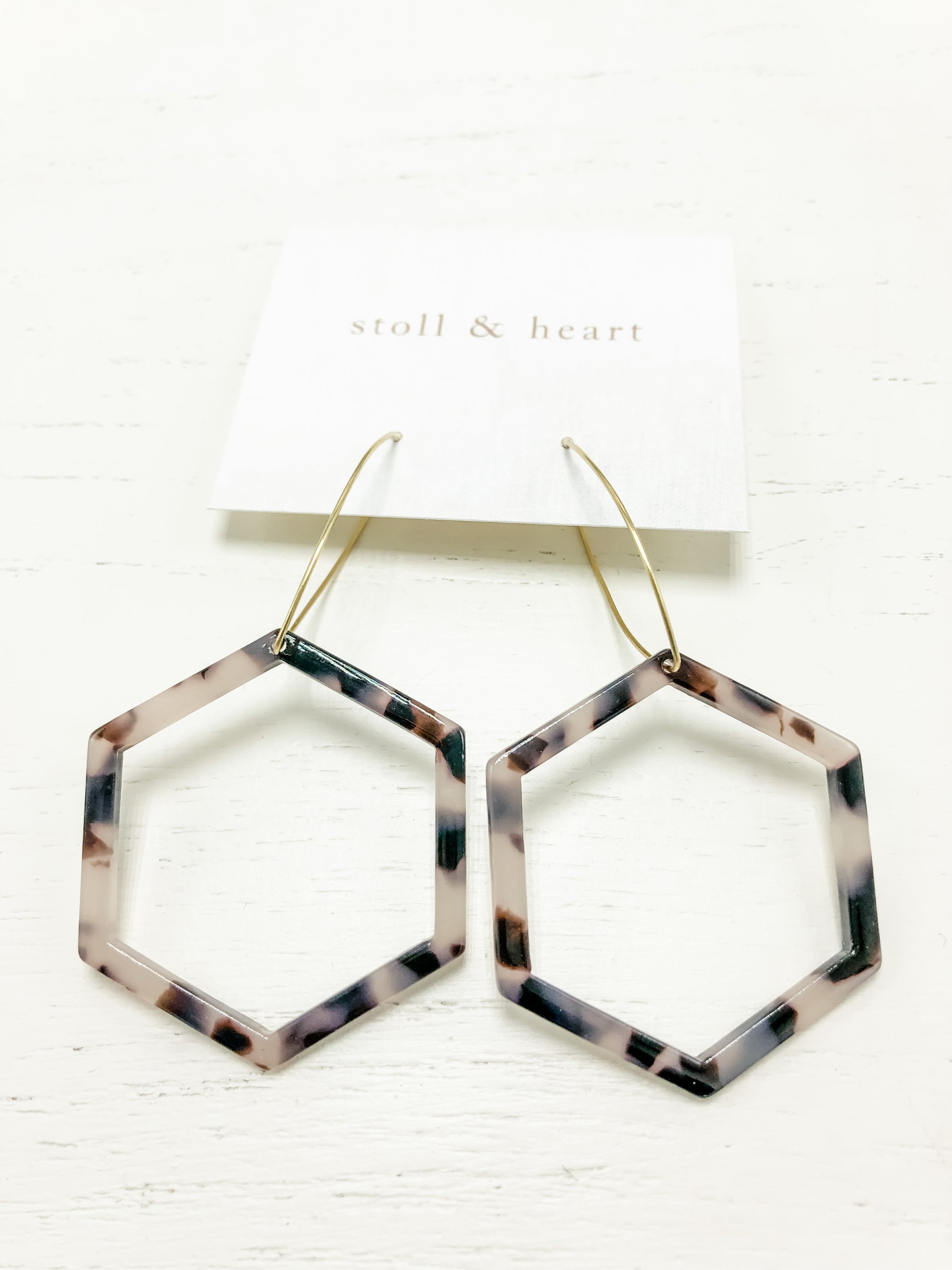 The Mae Grey Tortoise earrings featuring brass hoops and grey tortoise shell resin detail, measuring approximately 3 inches in length.